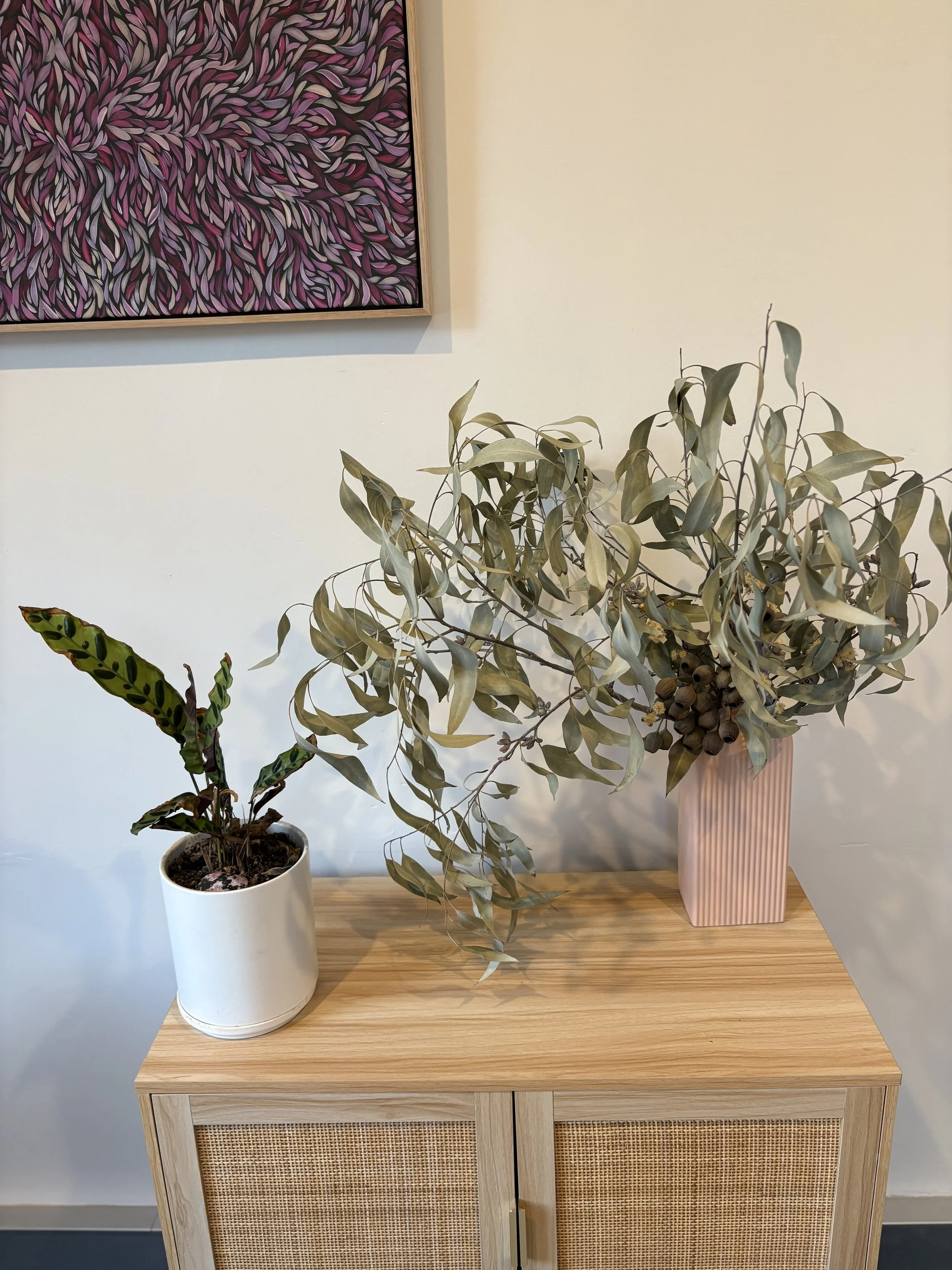 natural flowers sitting on wood table in office