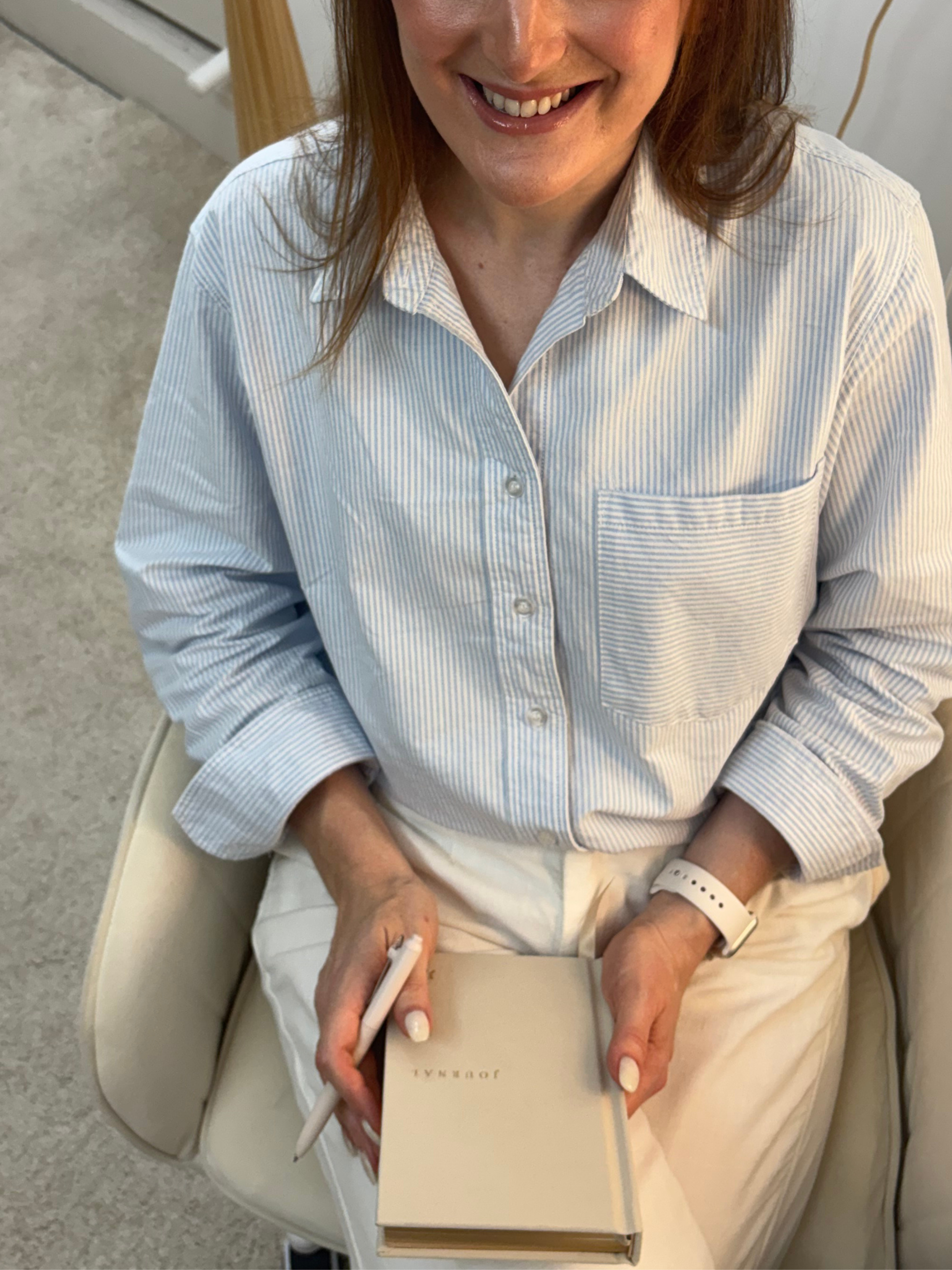 Jazmin Pursell, sitting down, holding journal and pen in lap