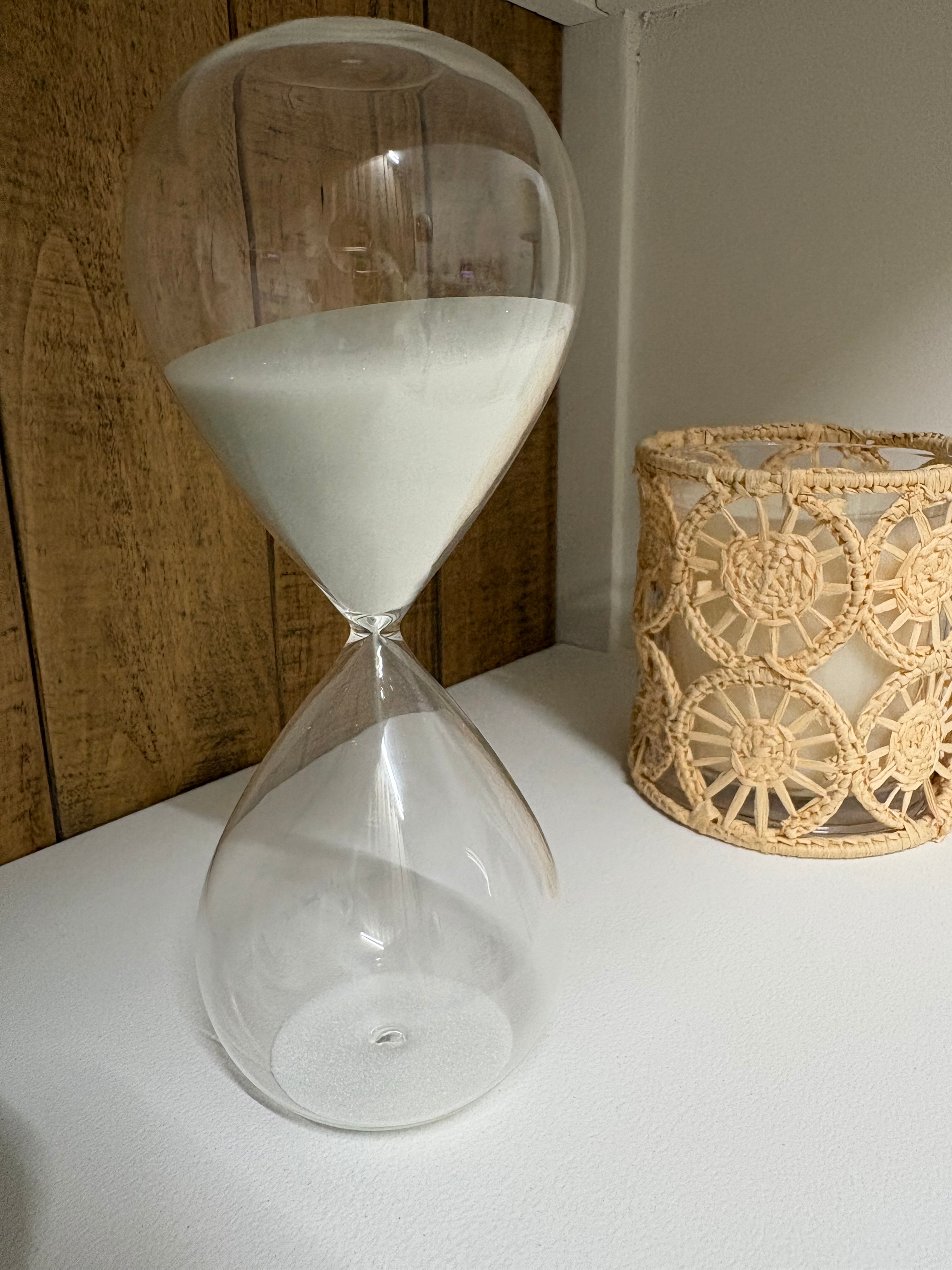 Jazmin Pursell home office, white sand timer and candle in neutral colours