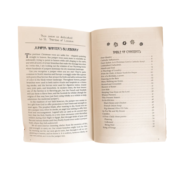 Open book with a dedication page and a table of contents. The dedication mentions 'St. Therese of Lisieux' and the table of contents lists various Christmas and winter-themed songs and poems.