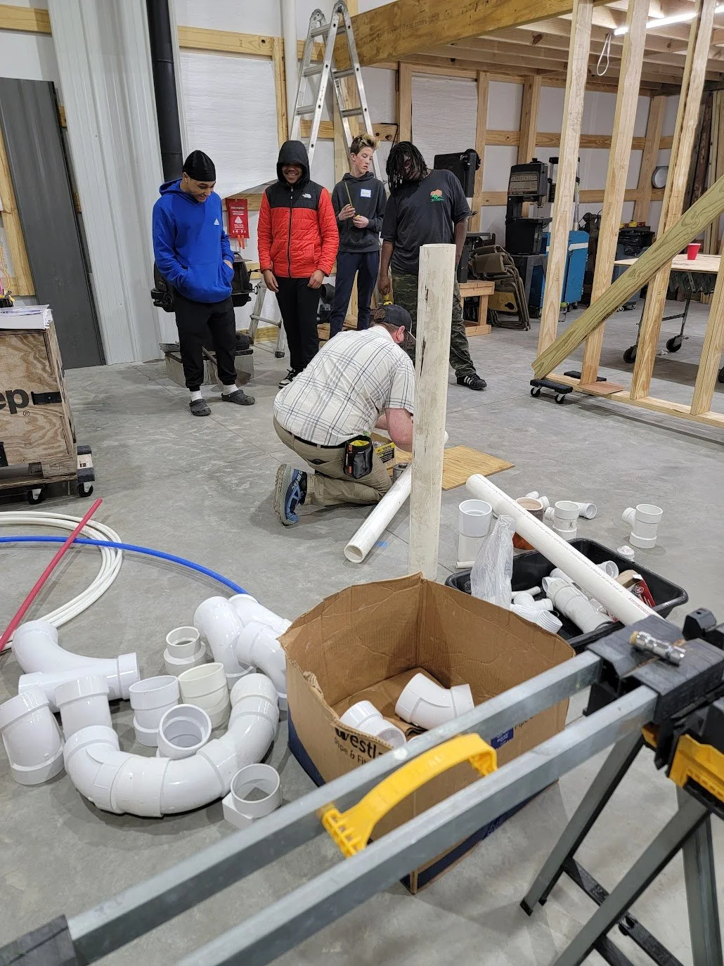 Youth participants building a project during a TradeWorks Collective workshop