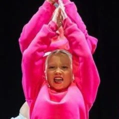 Dark blue silhouette of a person against a light blue circular background.