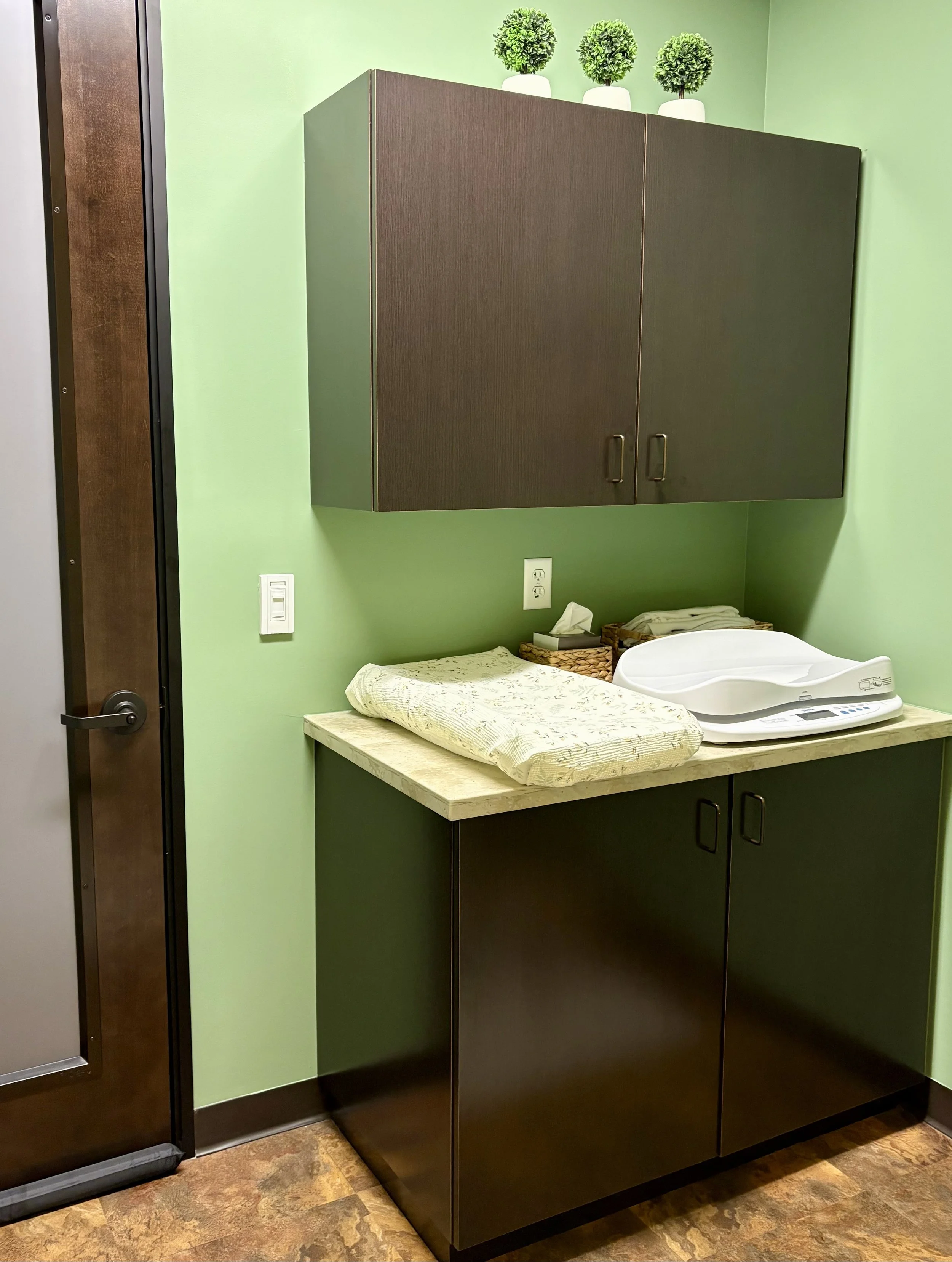 Lactation consultant office in Lafayette Colorado with baby scale and changing table for infant feeding assessments