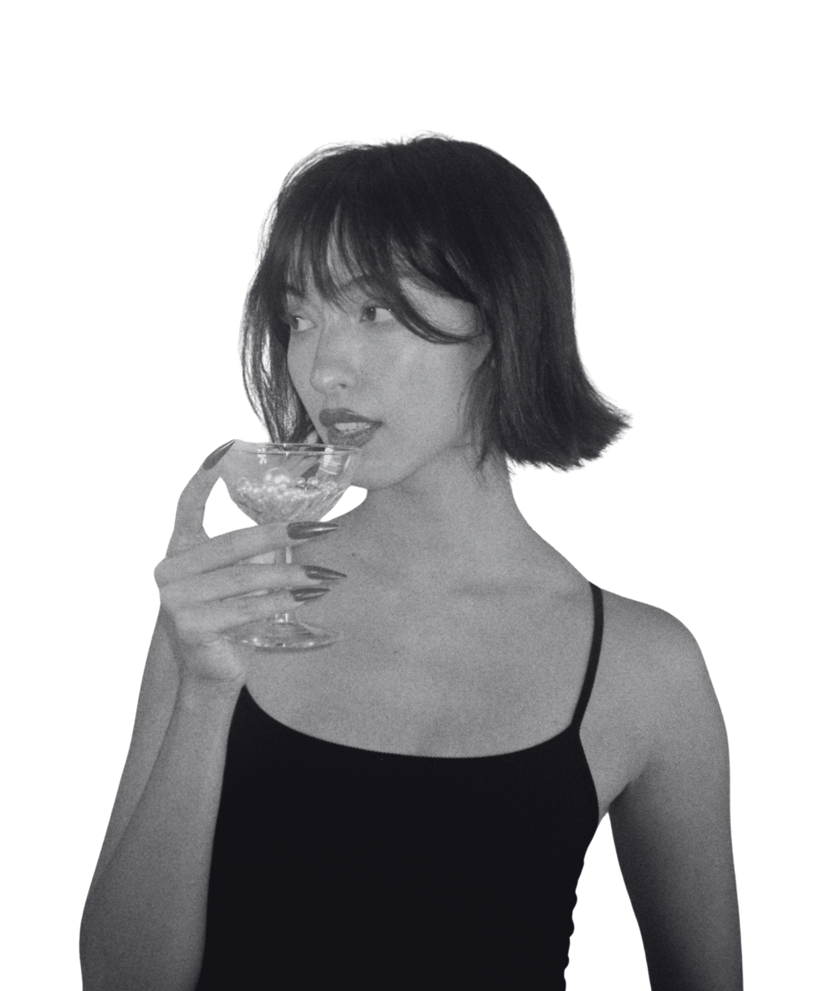 Girl drinking from wine glass of jewels