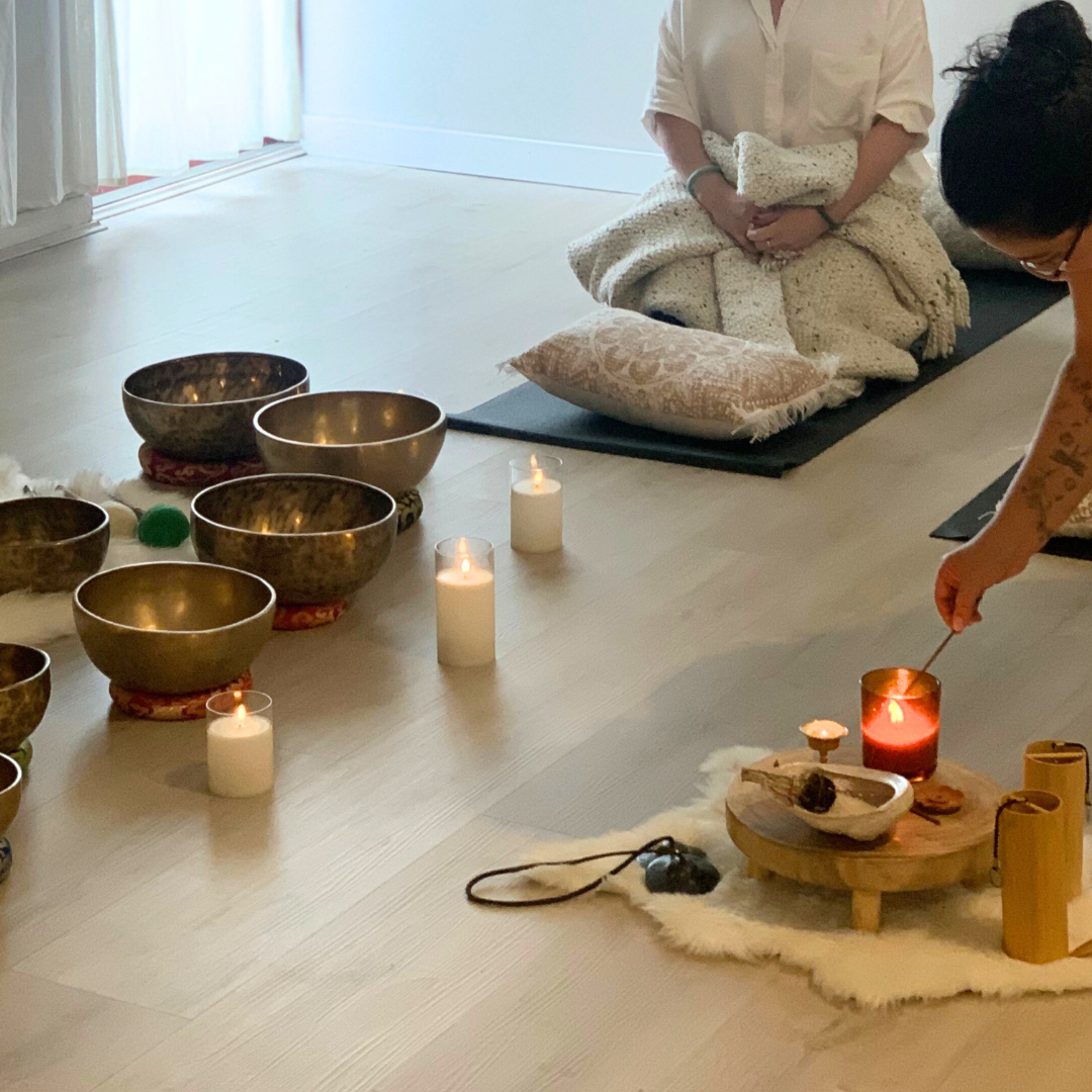 A glass of water with sunlight creating a light pattern on the wall