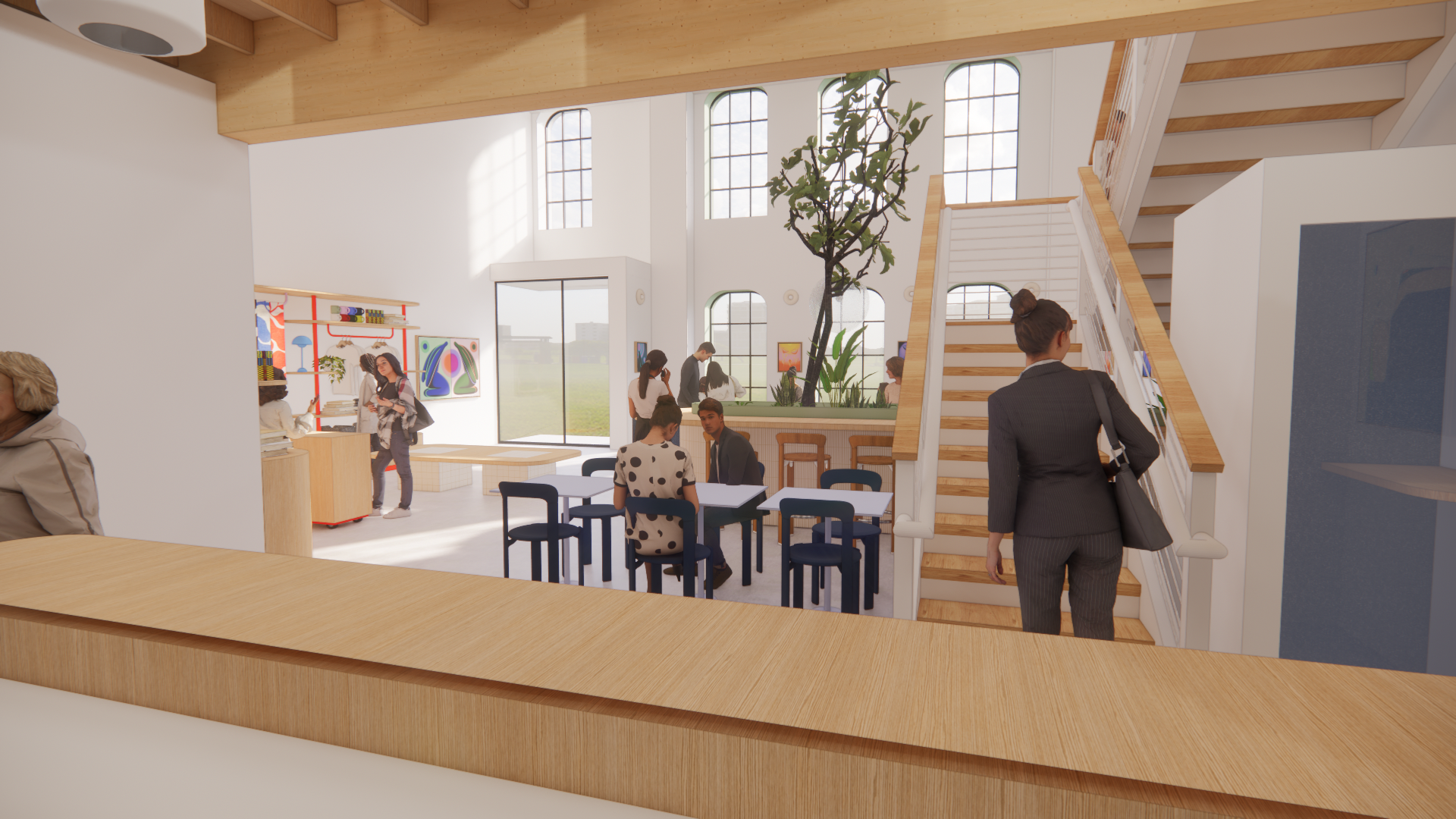 Interior of a modern, bright café or lounge with large windows, a tree in the center, and people sitting and standing around; a staircase with wooden steps on the right side.