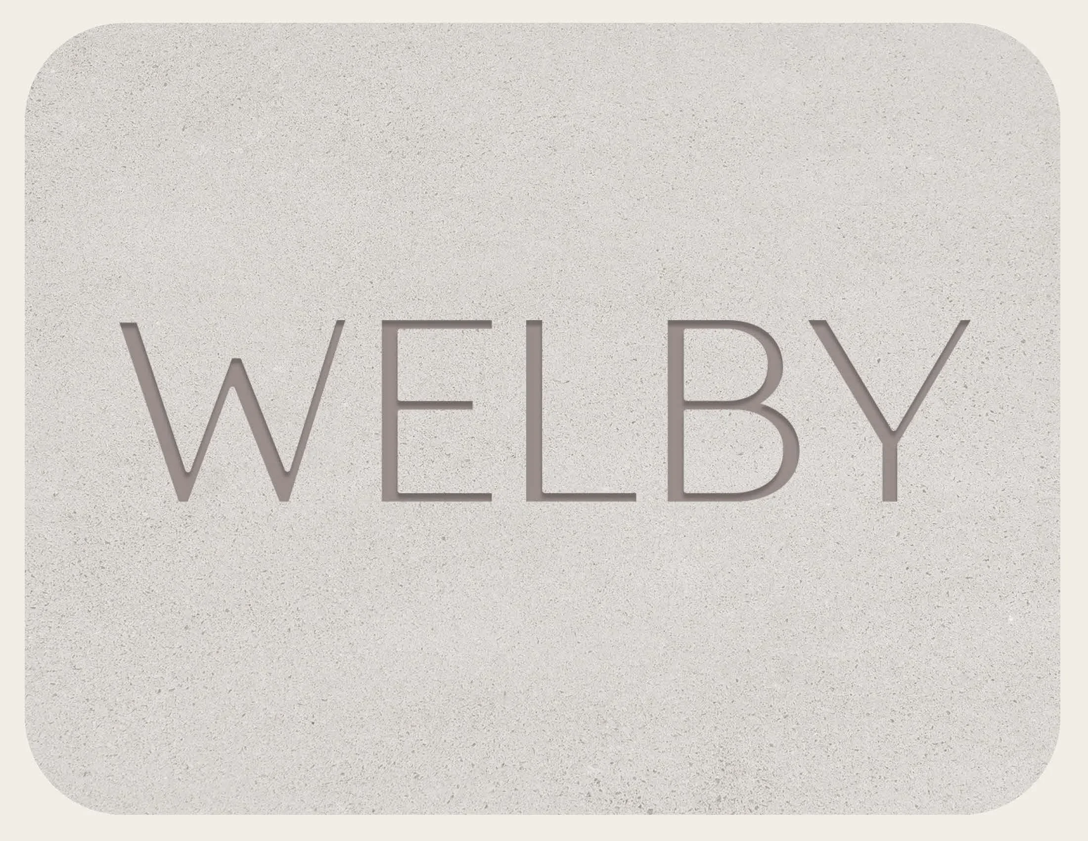 The word 'WEBY' engraved in the center of a beige stone plaque.