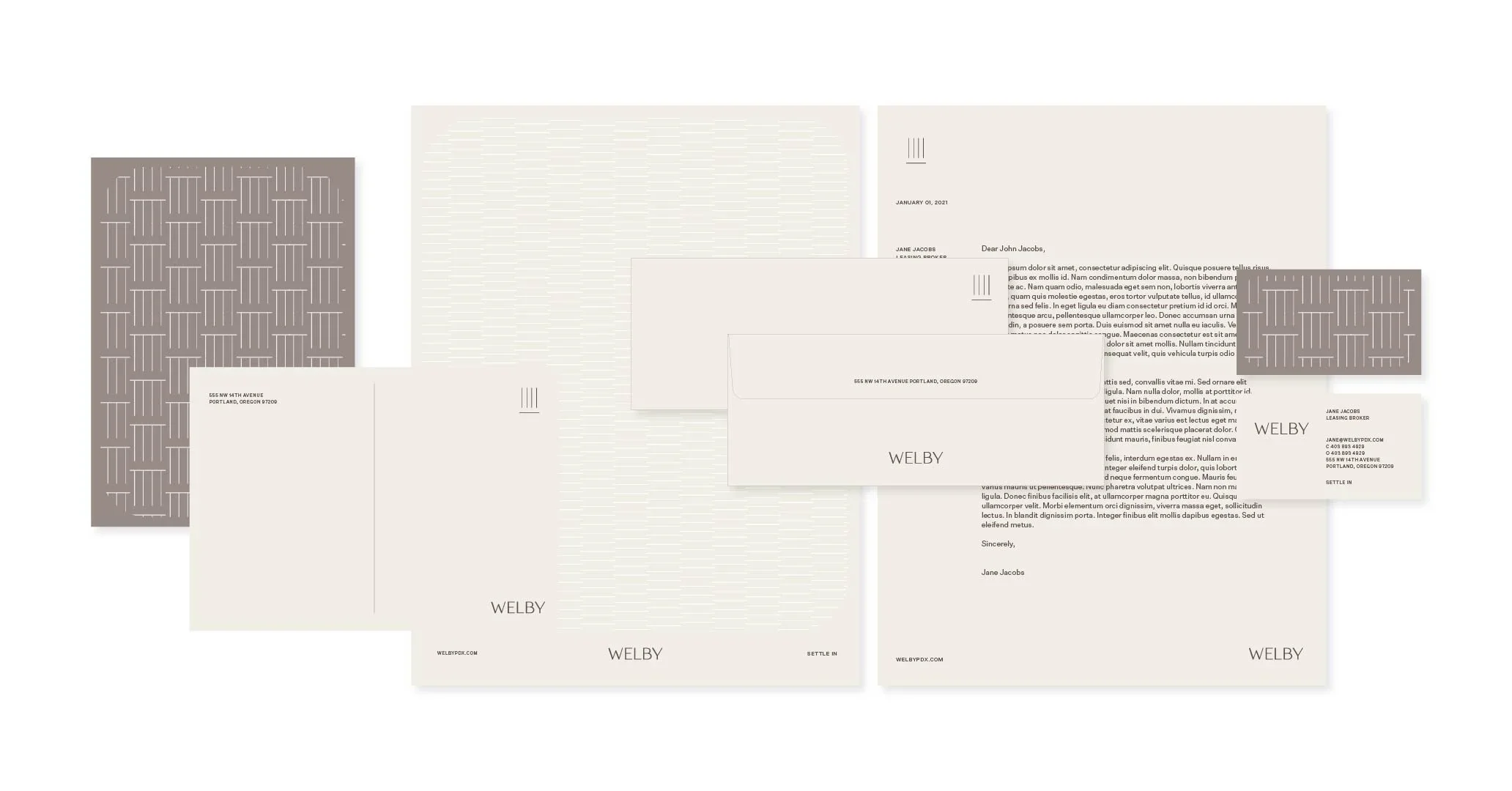 Set of stationery items including envelopes, letter papers, and business cards with minimalist design and branding for Welby.