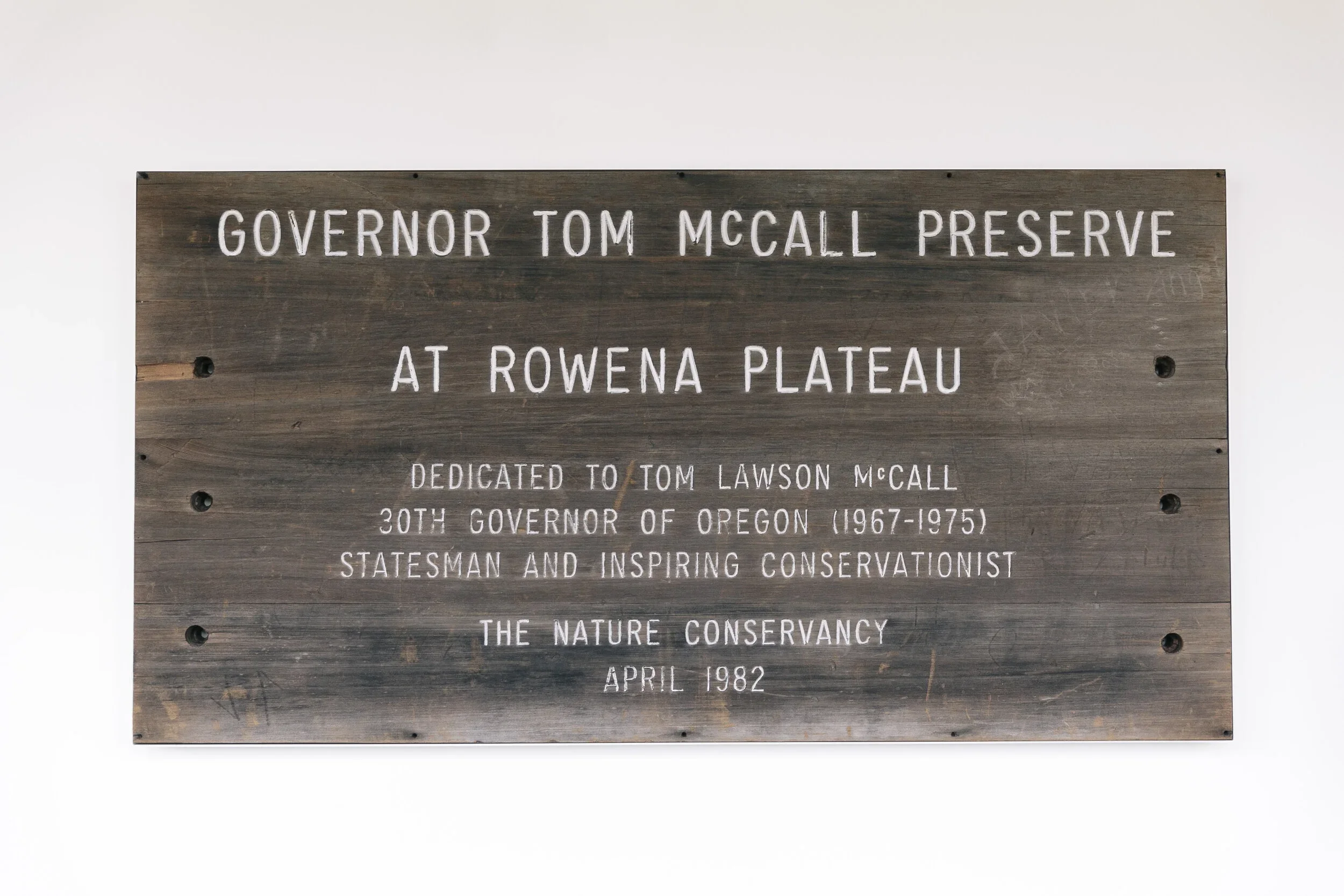 Wooden memorial plaque dedicated to Tom Lawson McCall at Rowena Plateau, Oregon, April 1982.