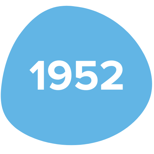 A blue irregularly shaped background with the white text "1952" in the center.