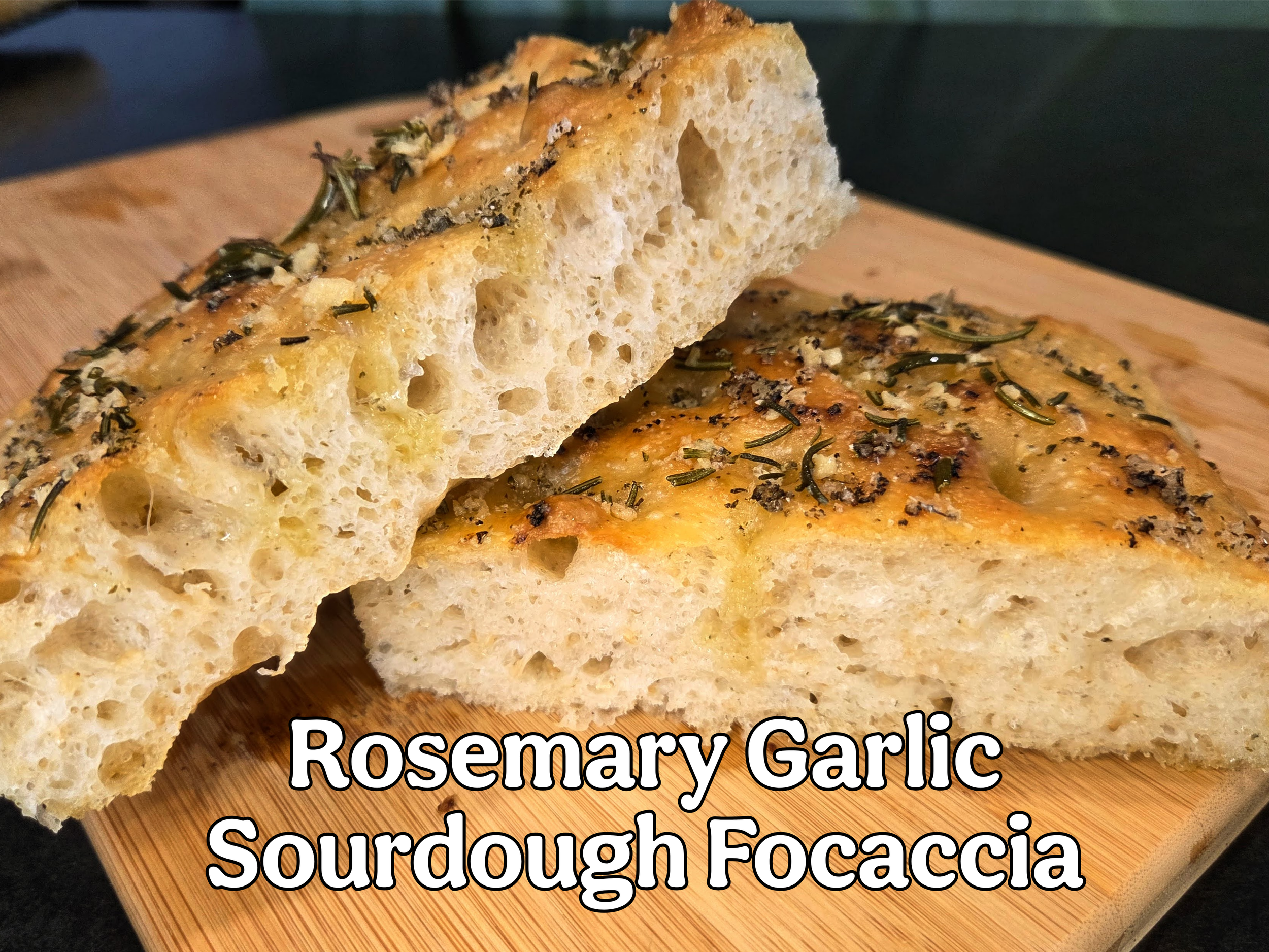 Cross cut image of sliced rosemary garlic sourdough focaccia bread by Meg at Kapiti Delicious dough.