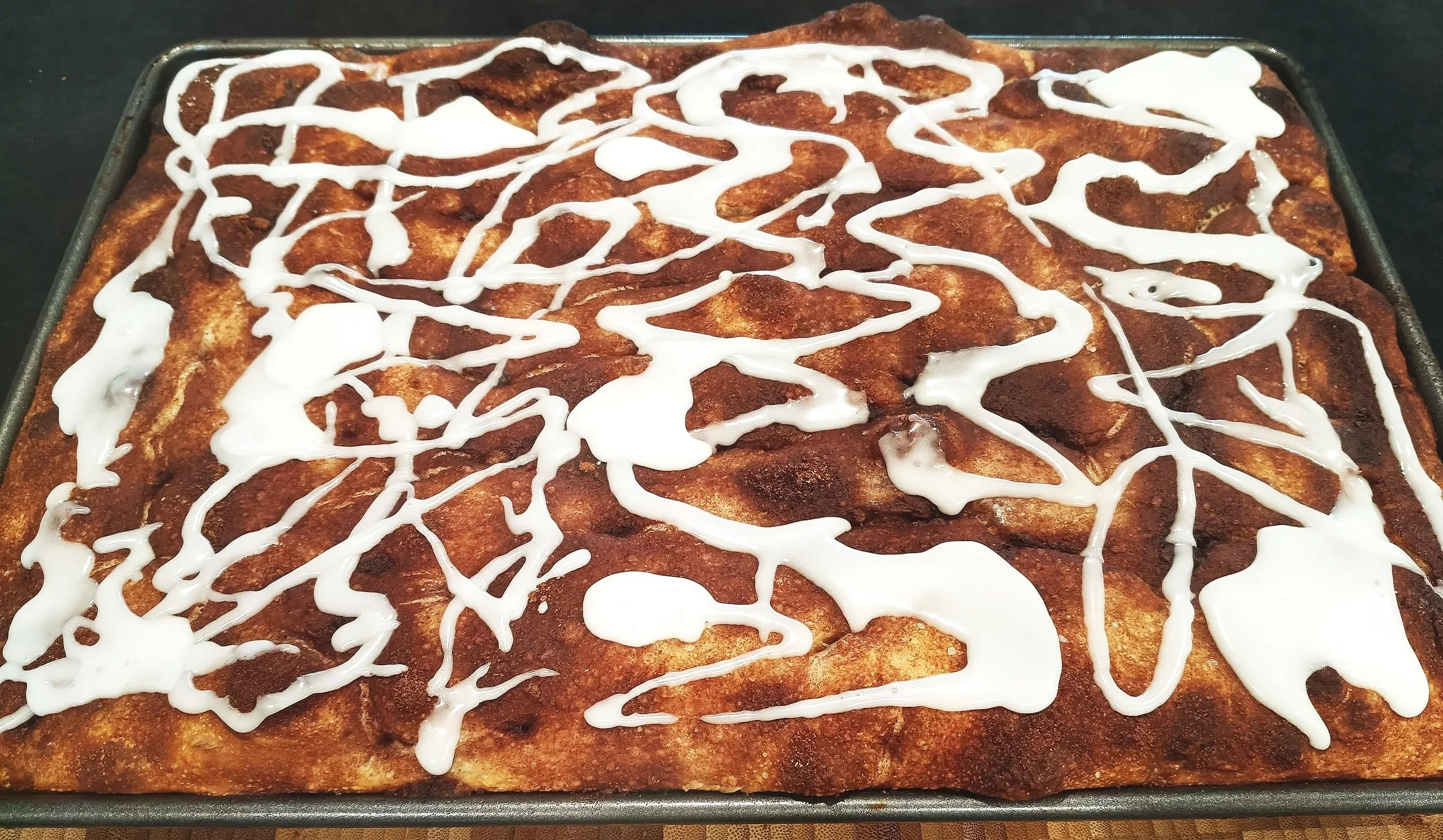 Freshly baked foccacia slab bread in sweet cinnamon sugar glaze flavour made by Kapiti Delicious Doughs - local sourdough specialist delivering across the Kapiti Coast