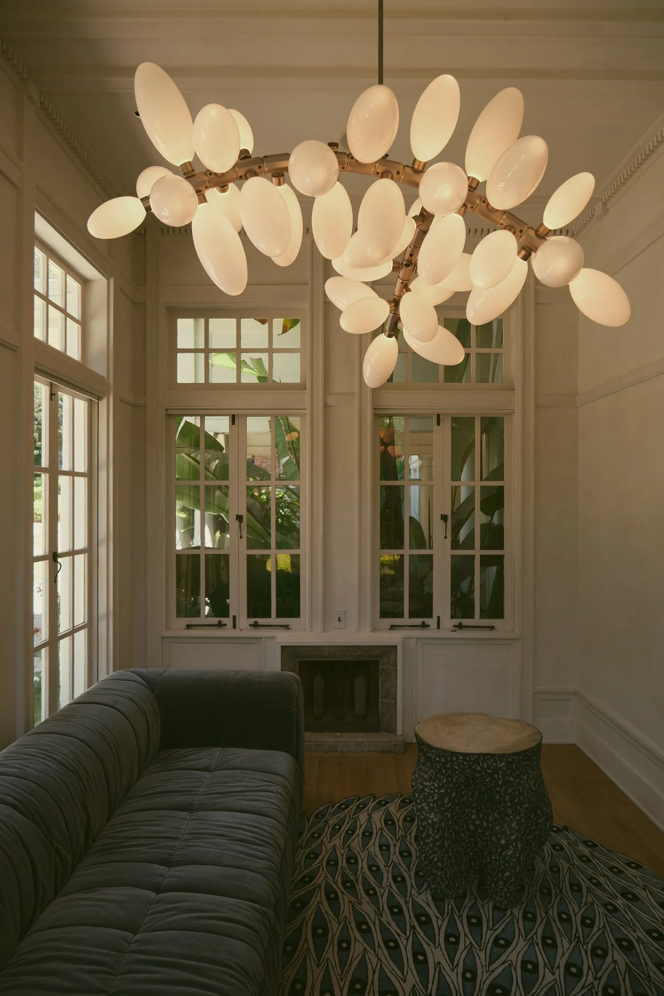 Artistic interior space featuring sculptural furniture and distinctive lighting design