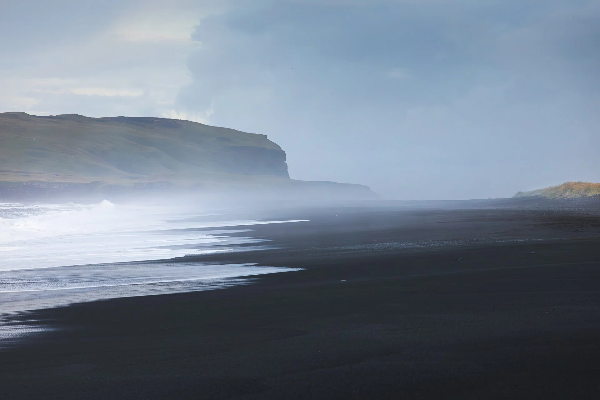 On Reynisfjara, the waves left a hazy mist 