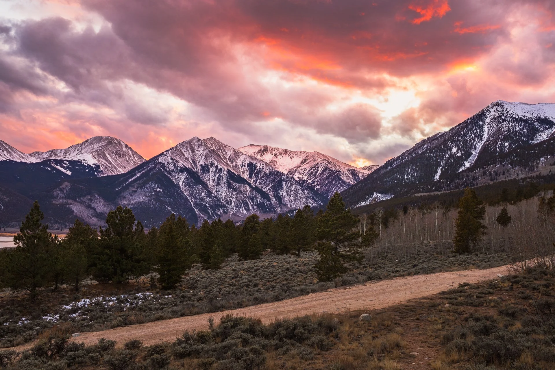 Sunset over Twin Lakes, Colorado with the Sawatch Range glowing in gold, pink, and purple tones.