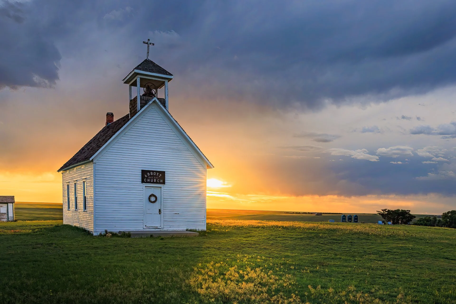 I drove out to Lindon, Colorado hoping to catch the Aurora, but it never really showed. Instead, I found this quiet little church glowing under stormy skies and fading light. The warmth, the stillness, the surprise of lightning in the distance—it was