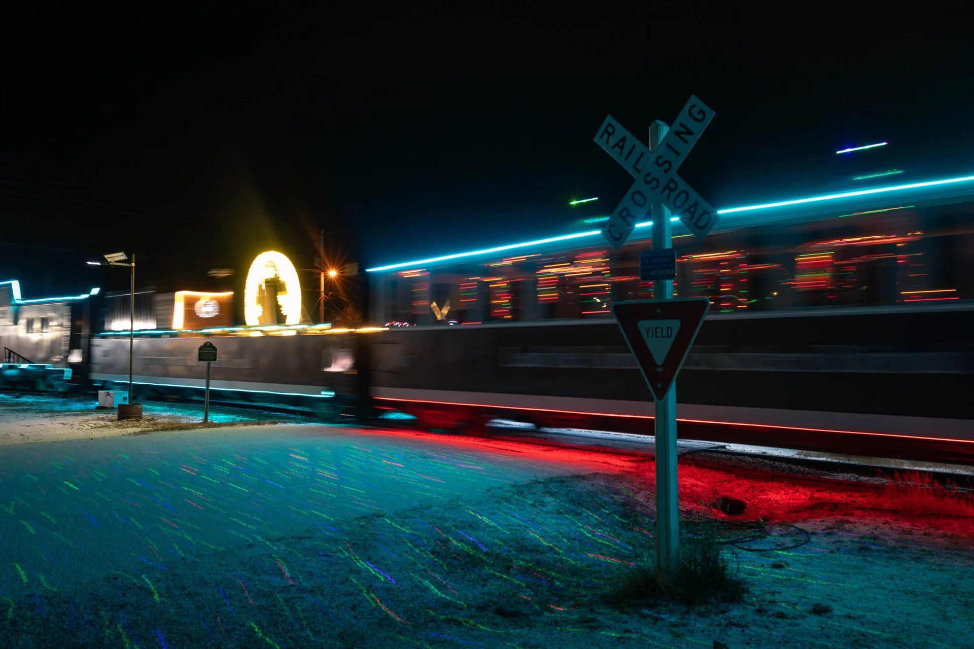 Blurred motion of the Holiday Express train leaving the Leadville train station on a winter night in Colorado