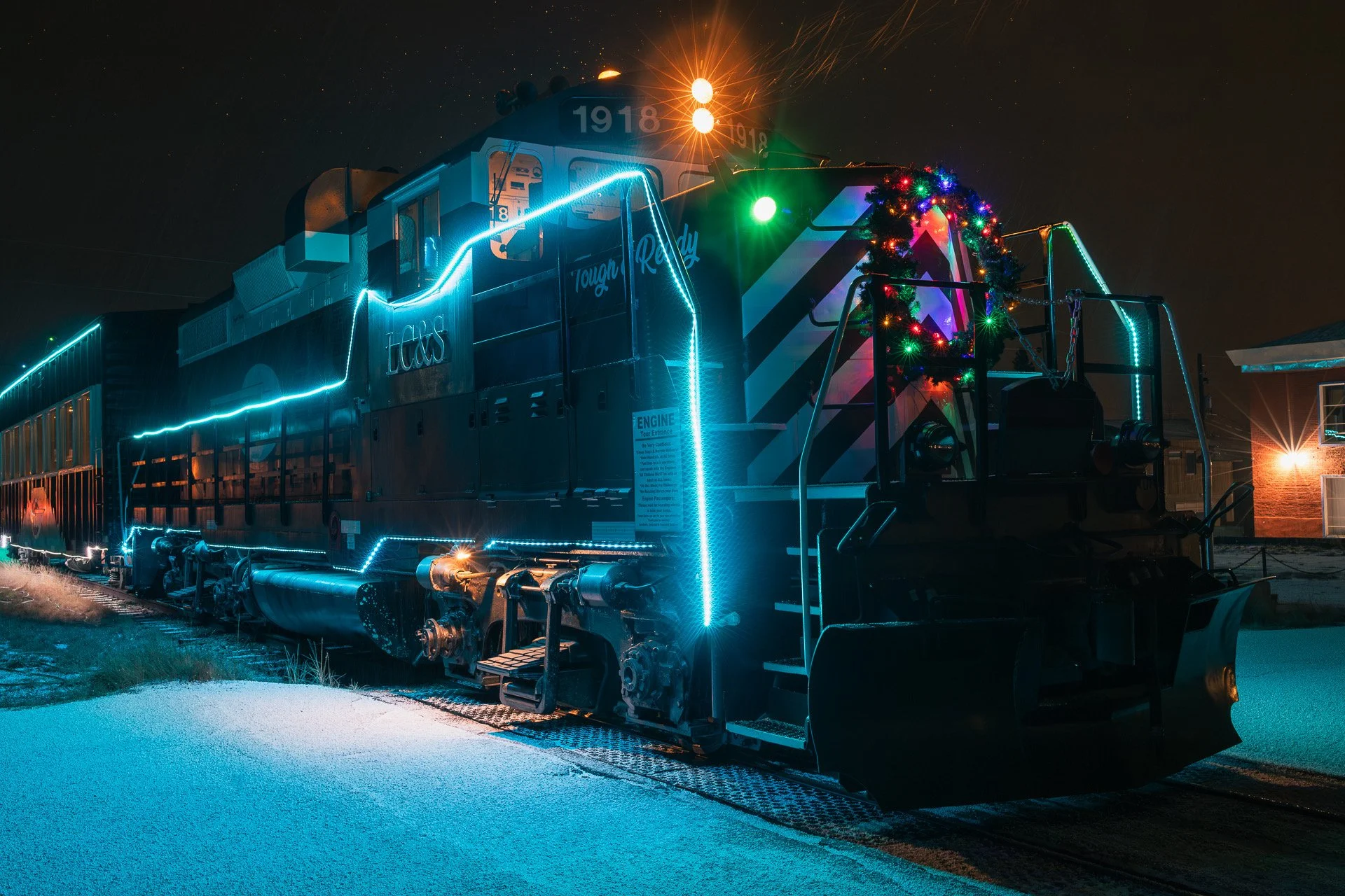 The Holiday Express train parked at the historic Leadville train station on a snowy winter night