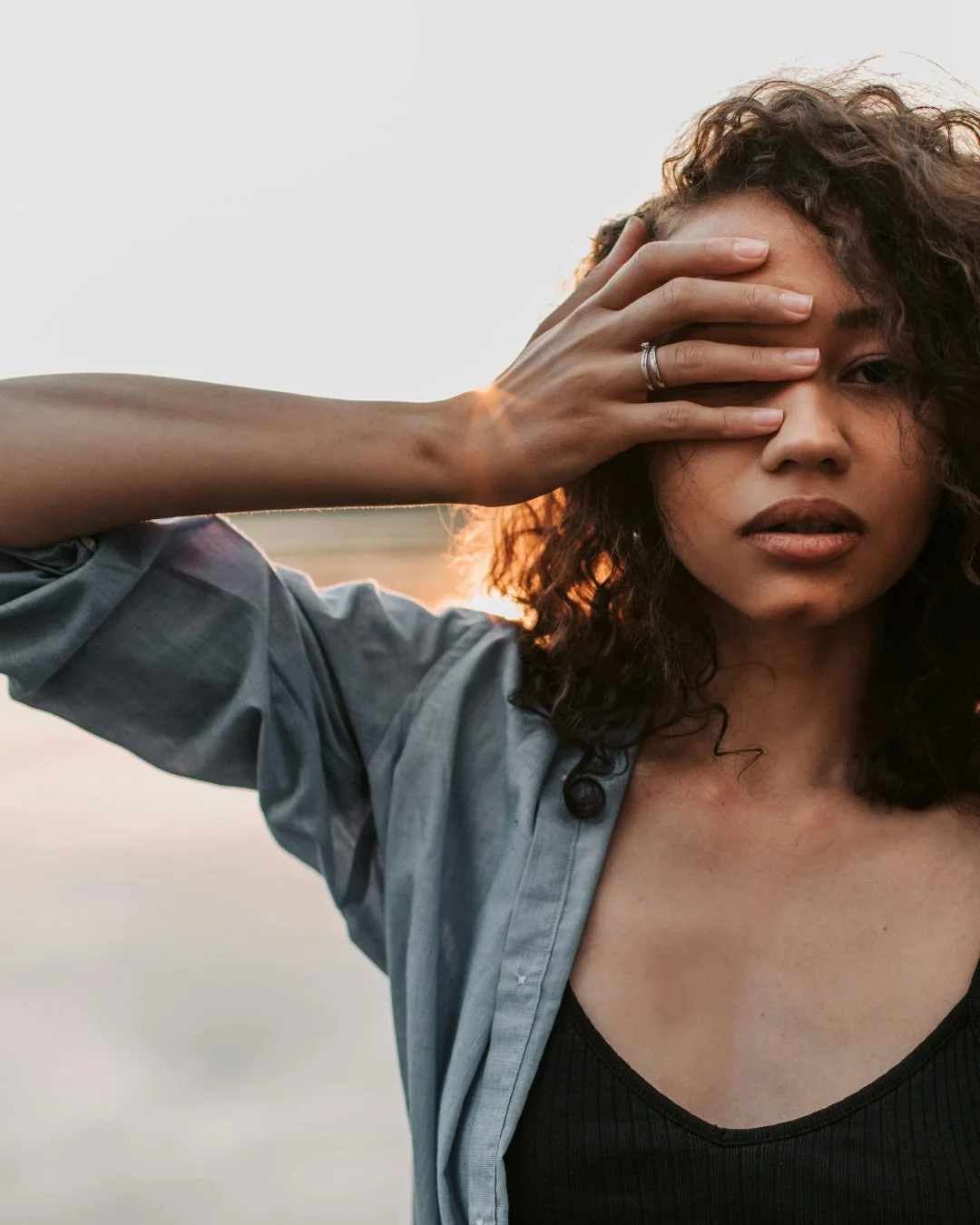 Woman with hand on her face