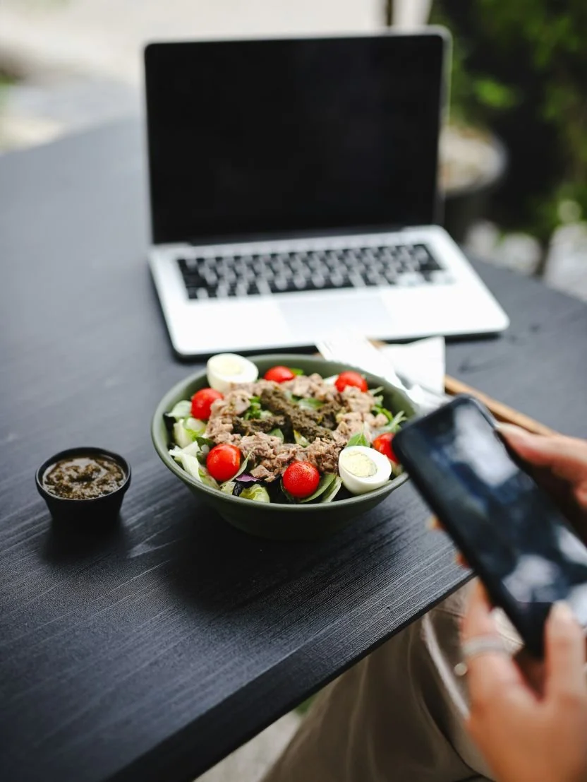 nutrition coaching session with a salad and computer in the background