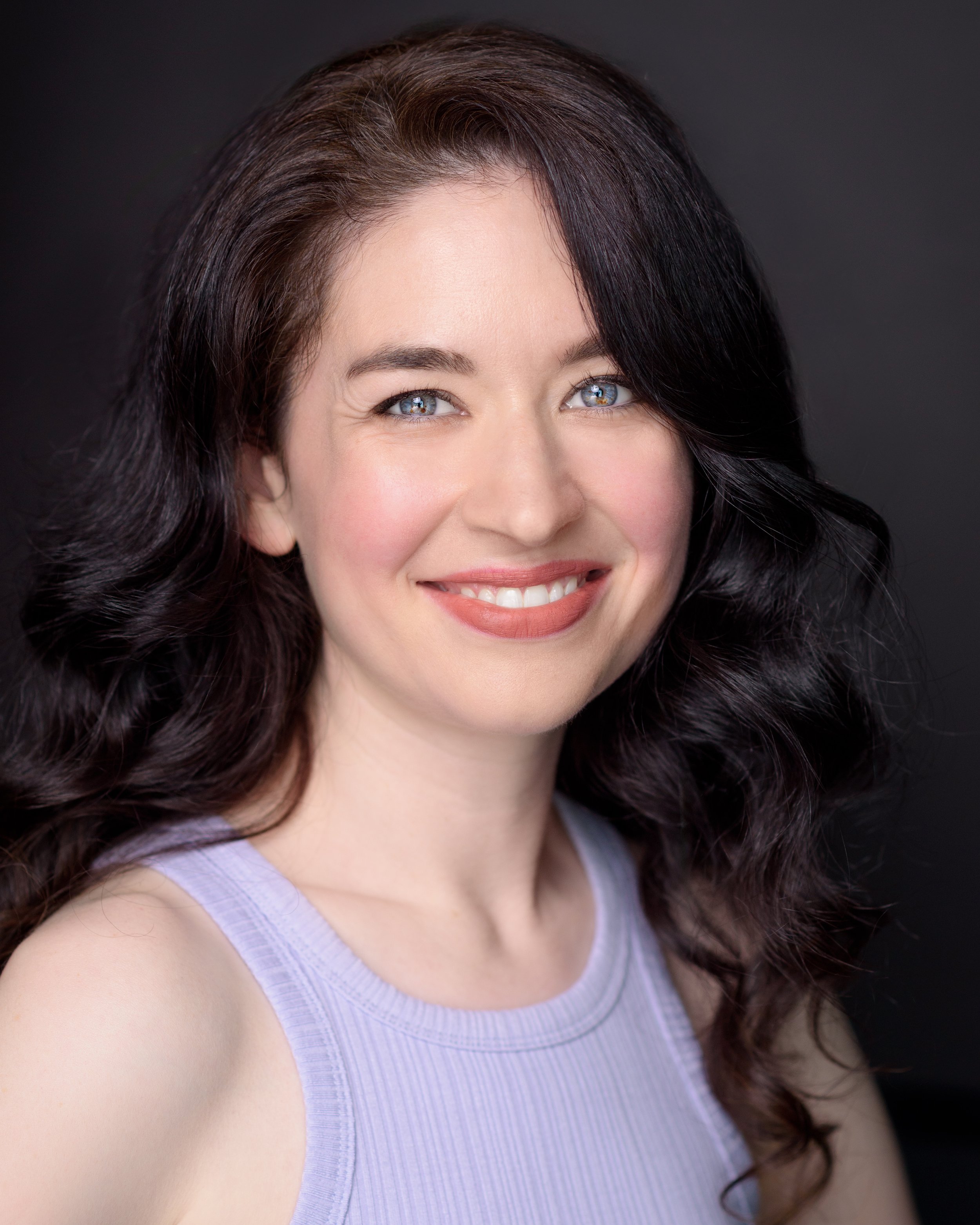 Smiling headshot of Sydney piano and vocal teacher Lauren Carey Kevin