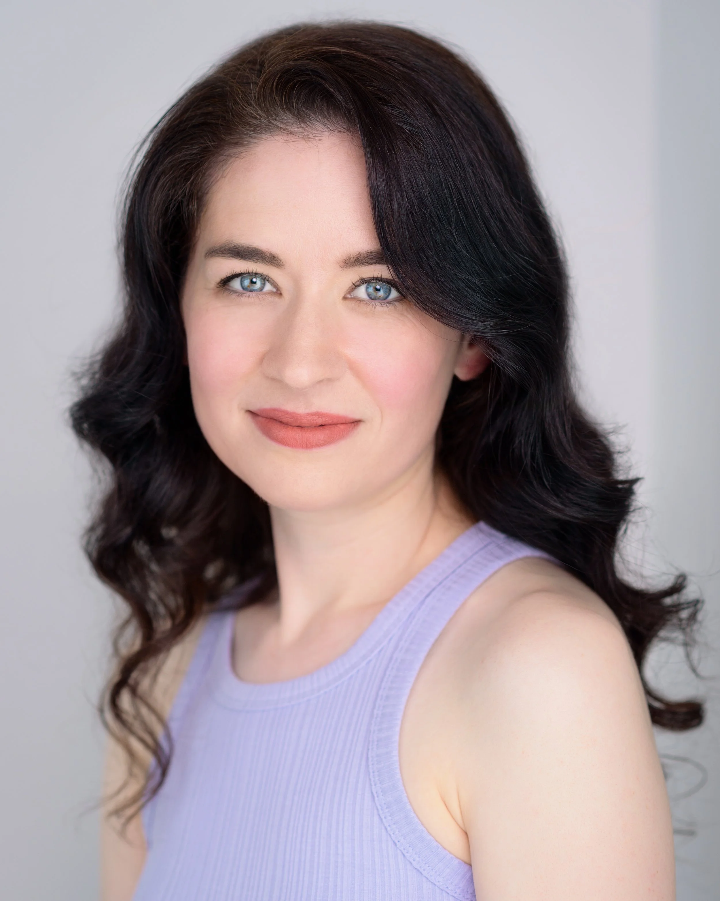 Sydney pianist Lauren Carey Kevin looking at camera in sleeveless lilac top