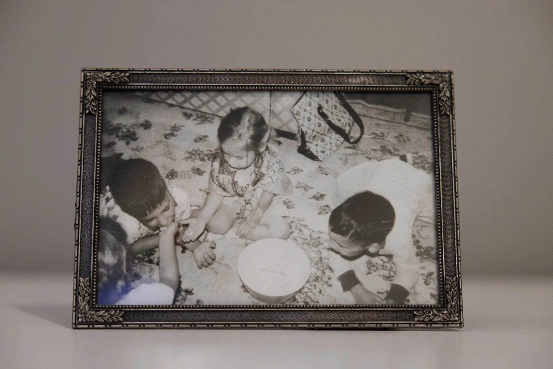 vintage framed photo of 4 kids eating popcorn in Grandparents' living room