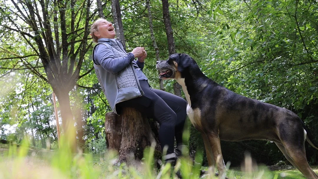 Photographer laughing with her Great Dane at Evans Creek Preserve