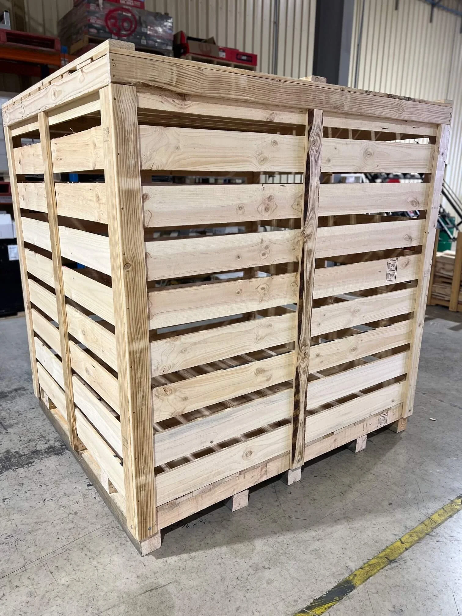 Scenic view of mountains, a lake, and rolling hills under a cloudy sky.