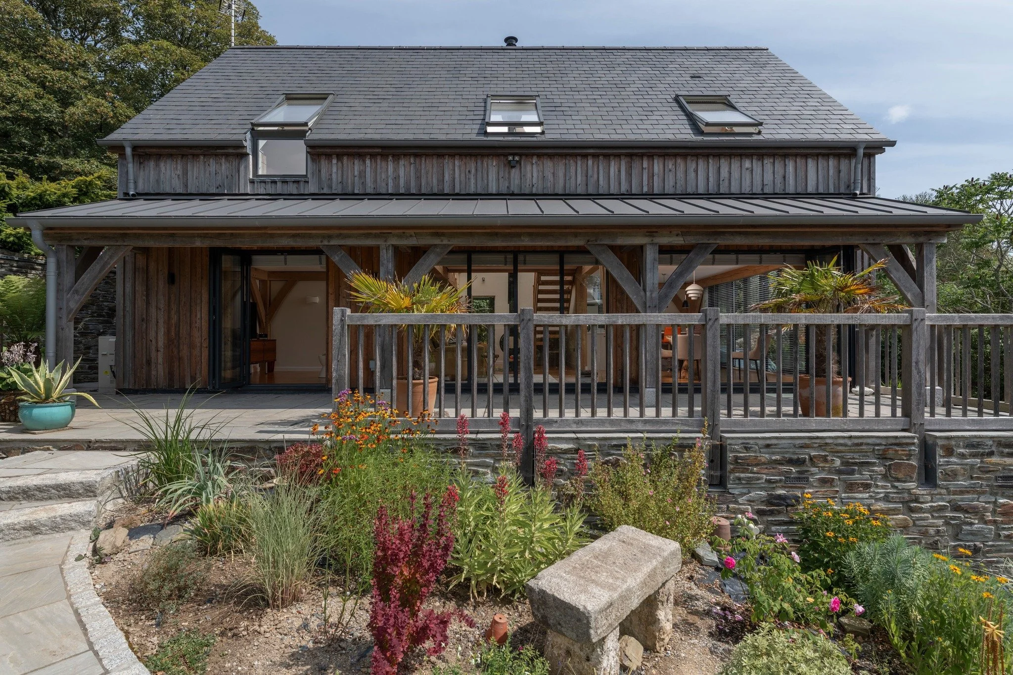 NEW CASE STUDY | Vale Rise - Oak-framed home in the landscape 🌿

Set on a steep, wooded site overlooking a valley, this one-and-a-half-storey, three-bay home combines a compact footprint with a generous sense of space.

Larch cladding, natural stone