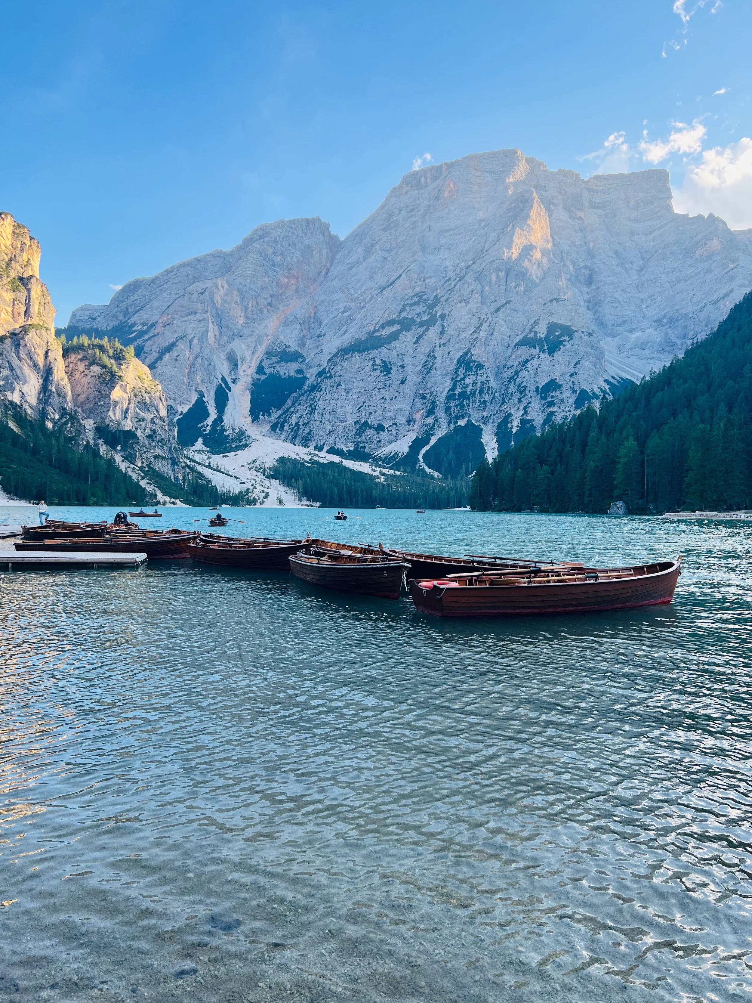 dolomites mountains and Lago di Braies with the boats