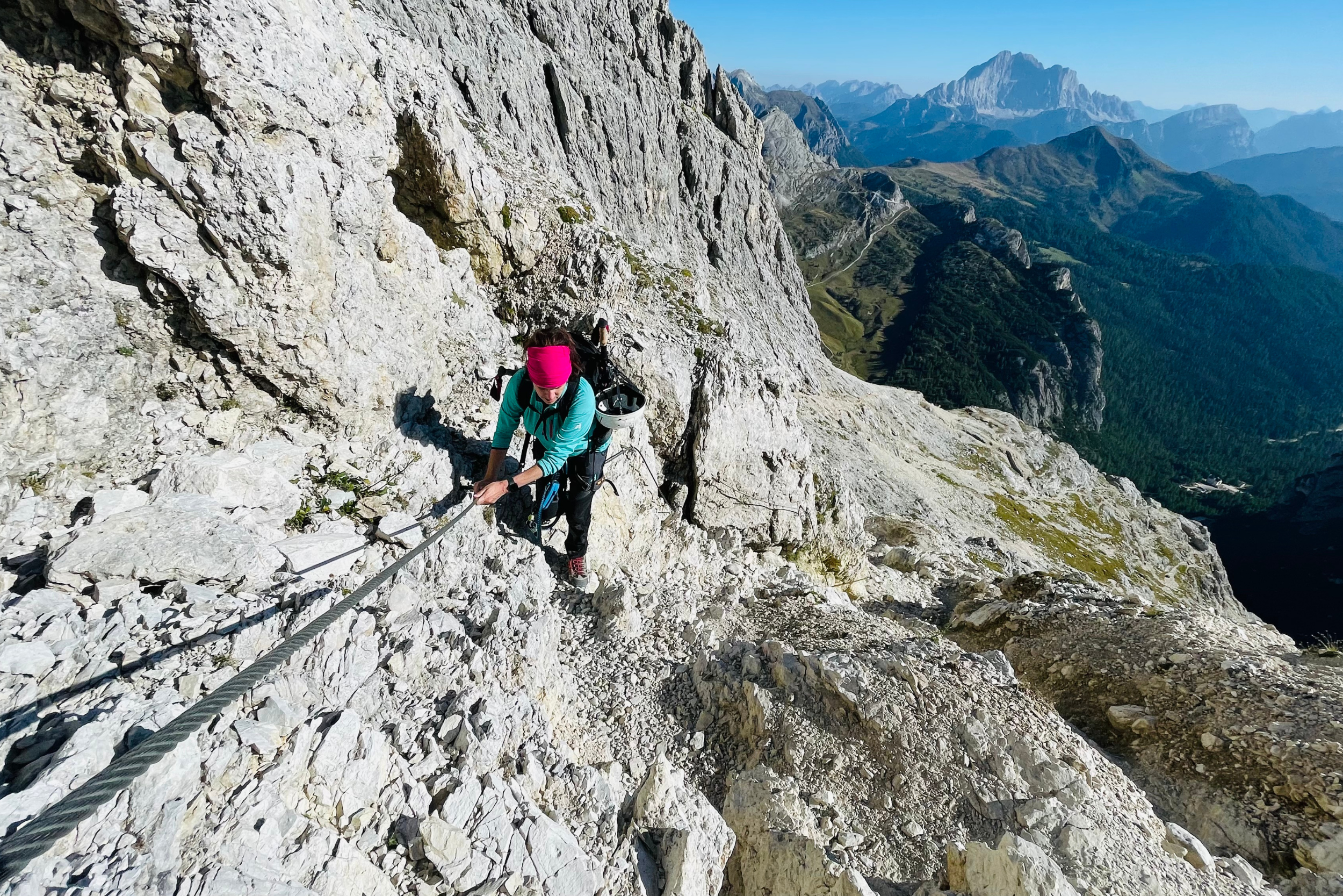 mountain climber on rope up dolomites rock mountain