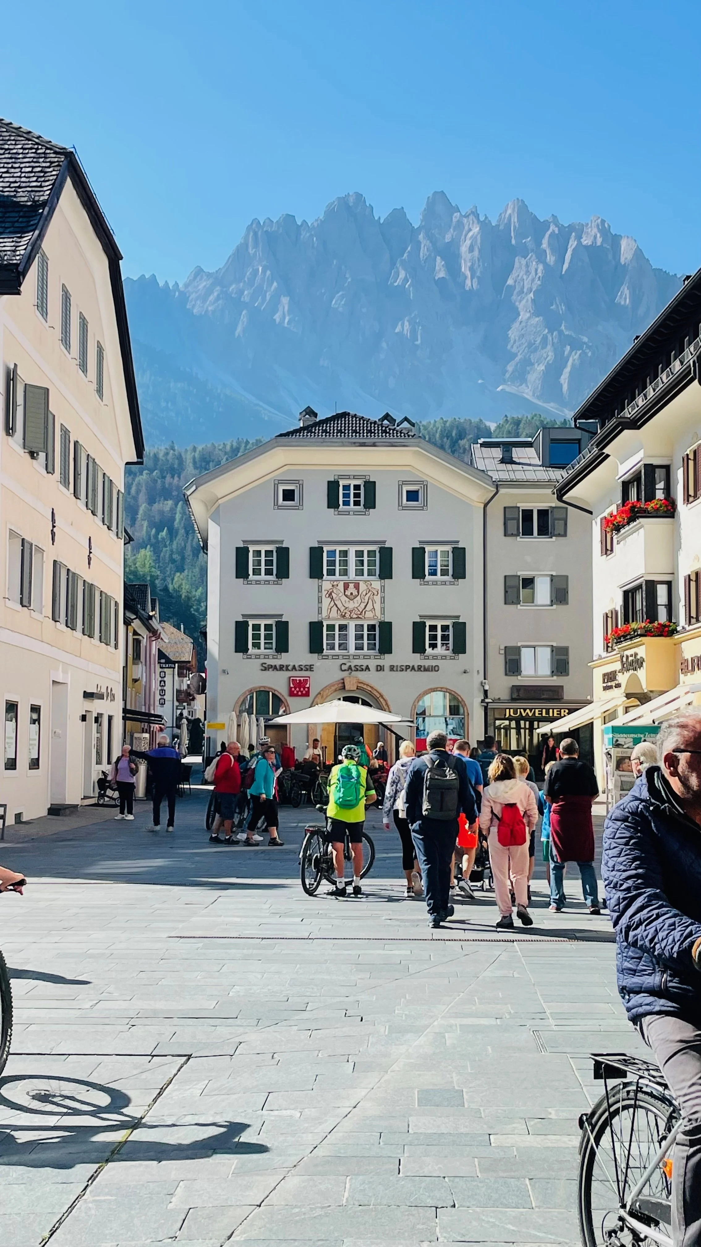 dolomites town with dolomites peaks in the background
