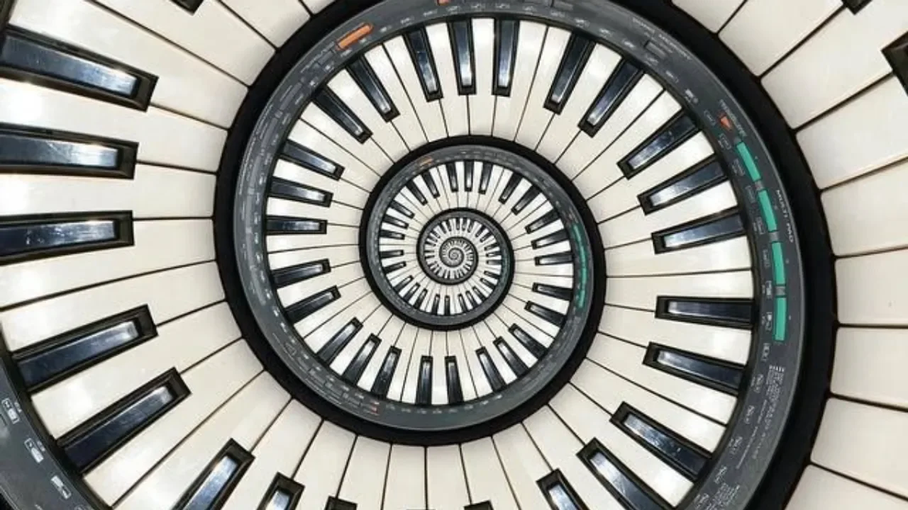 Spiral arrangement of piano keys forming a visual pattern suggestive of mathematical proportion in music.