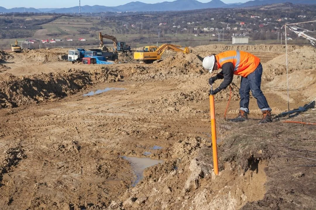Installing a groundwater monitoring well (piezometer) during a Phase 2 site investigation.