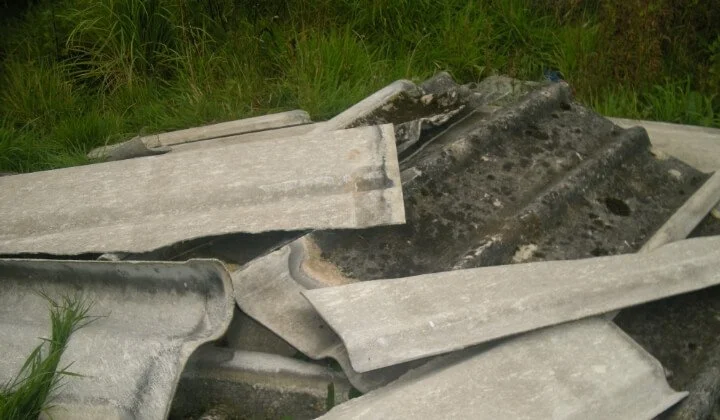 Broken asbestos sheet waste identified for safe removal during land remediation project