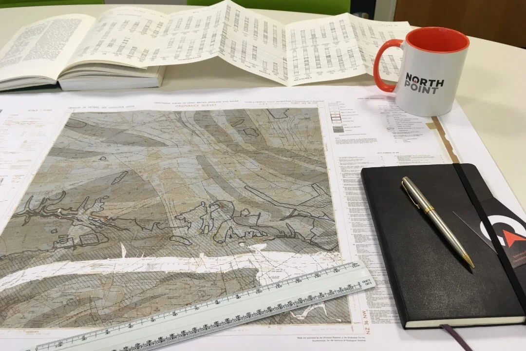 Geological survey map, ruler, and notebook used in a Phase 1 Desk Study by Northpoint Geotechnical.