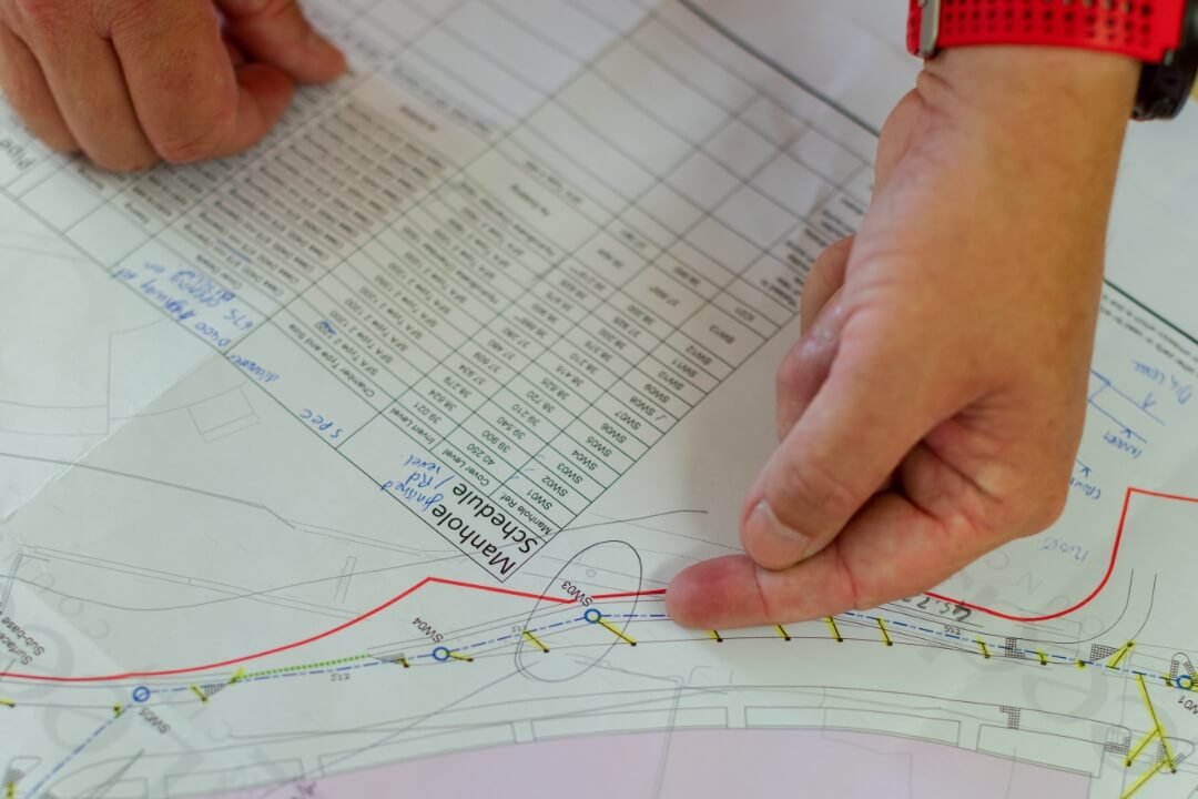 Close-up of geological assessment site plan showing risk analysis notes and boundary markings.