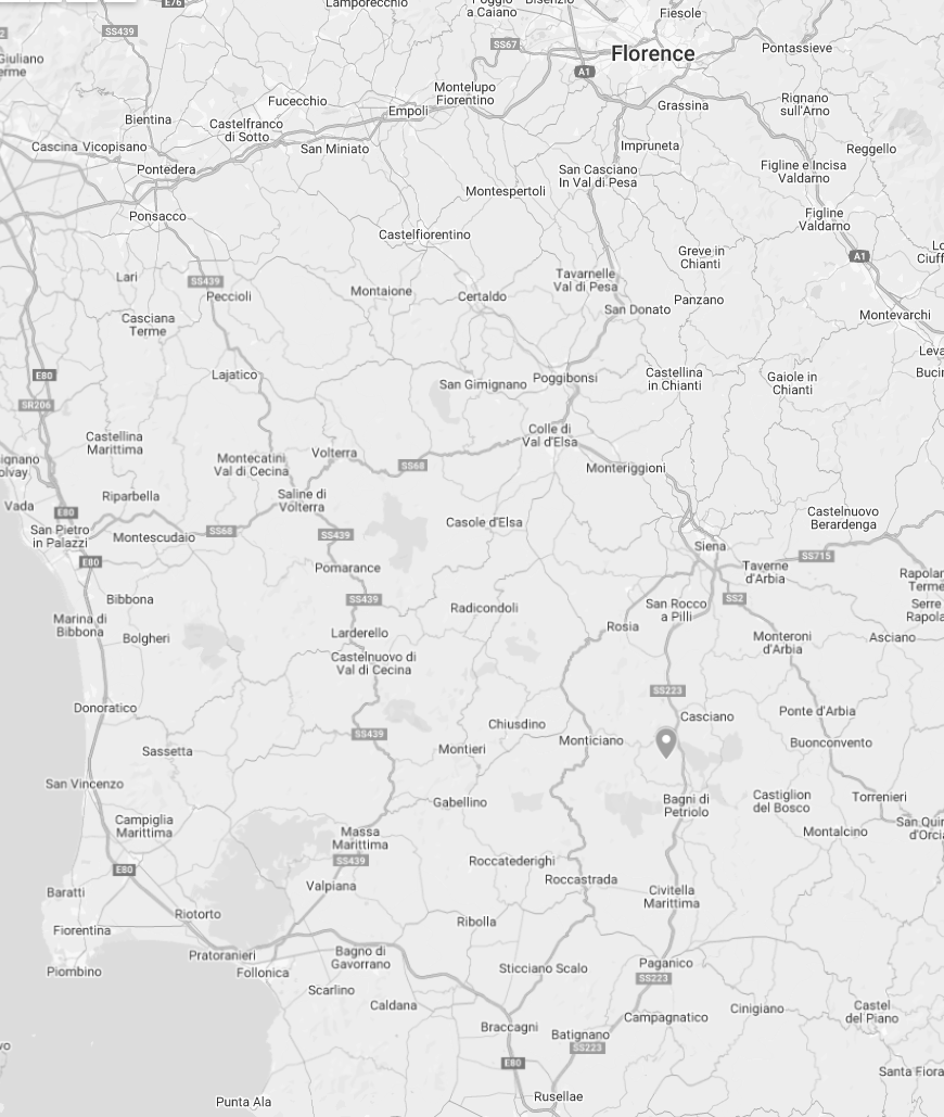 A grayscale map of a region in Italy showing various towns, cities, roads, and lakes.