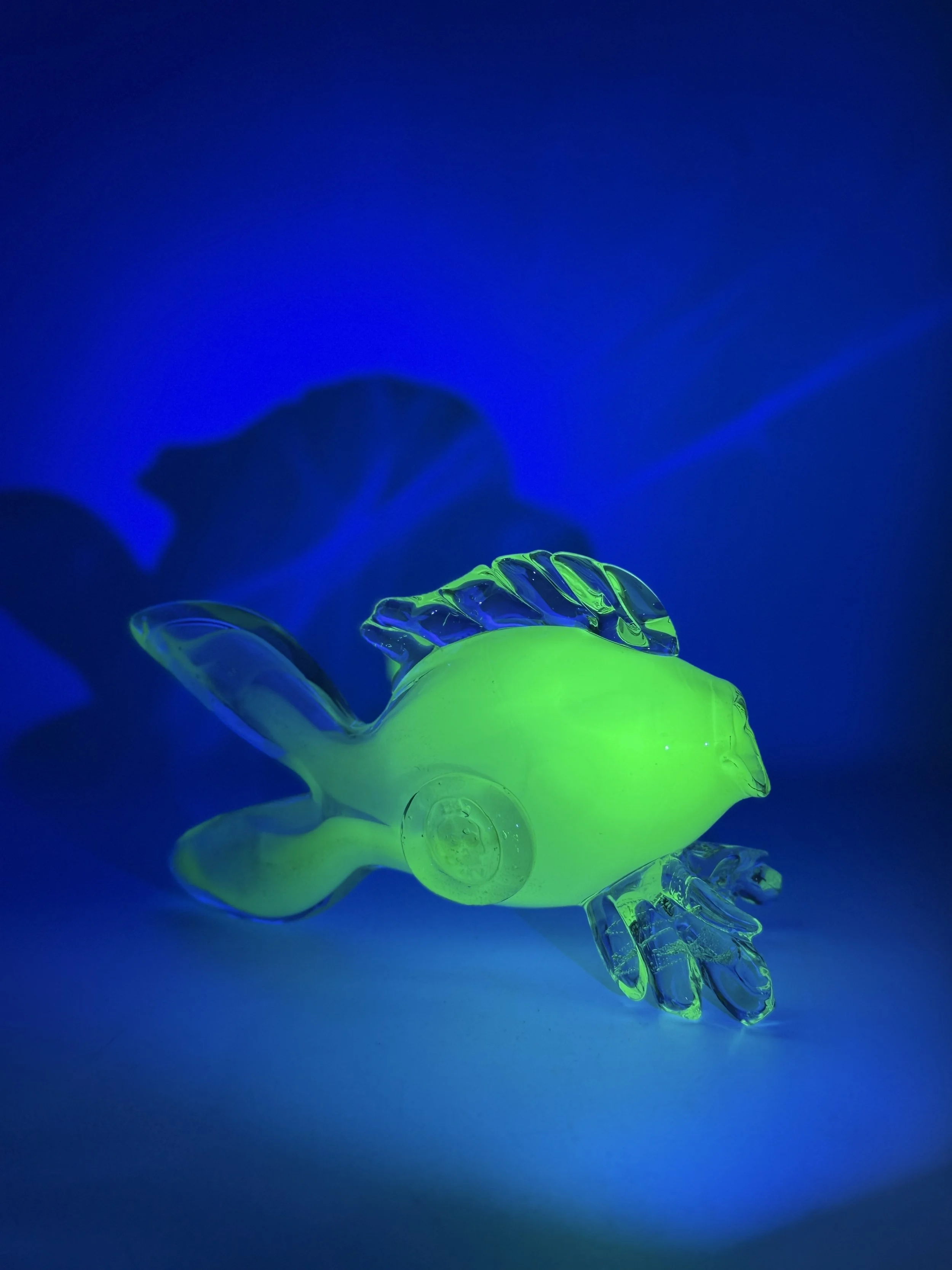 glowing green glass fish