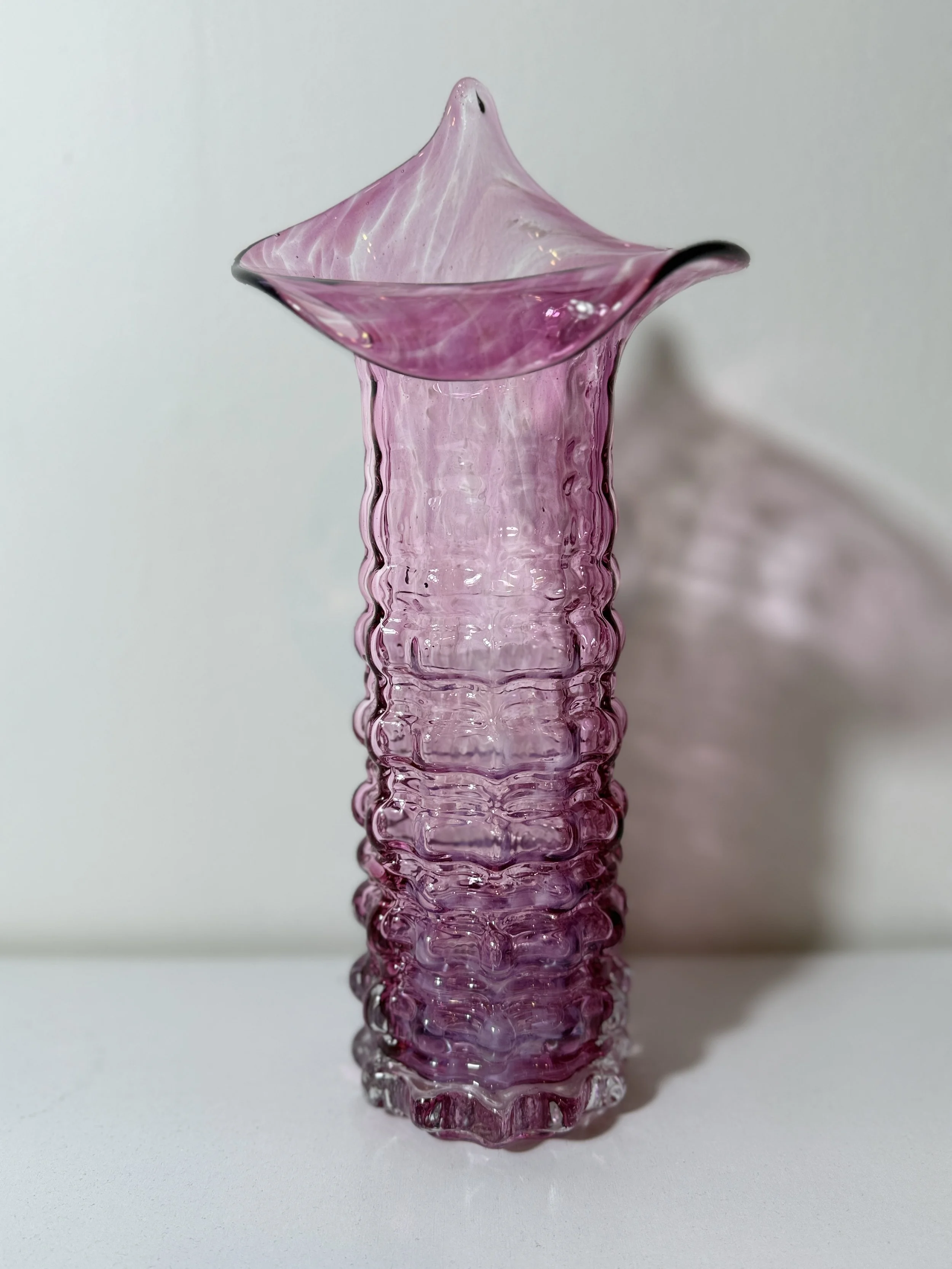 full photo of textured tall pink vase with organically floral flared jack in the pulpit lip