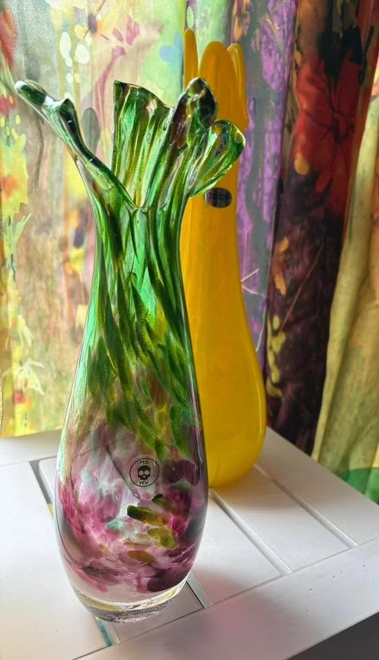 purple and green ramp vase in window