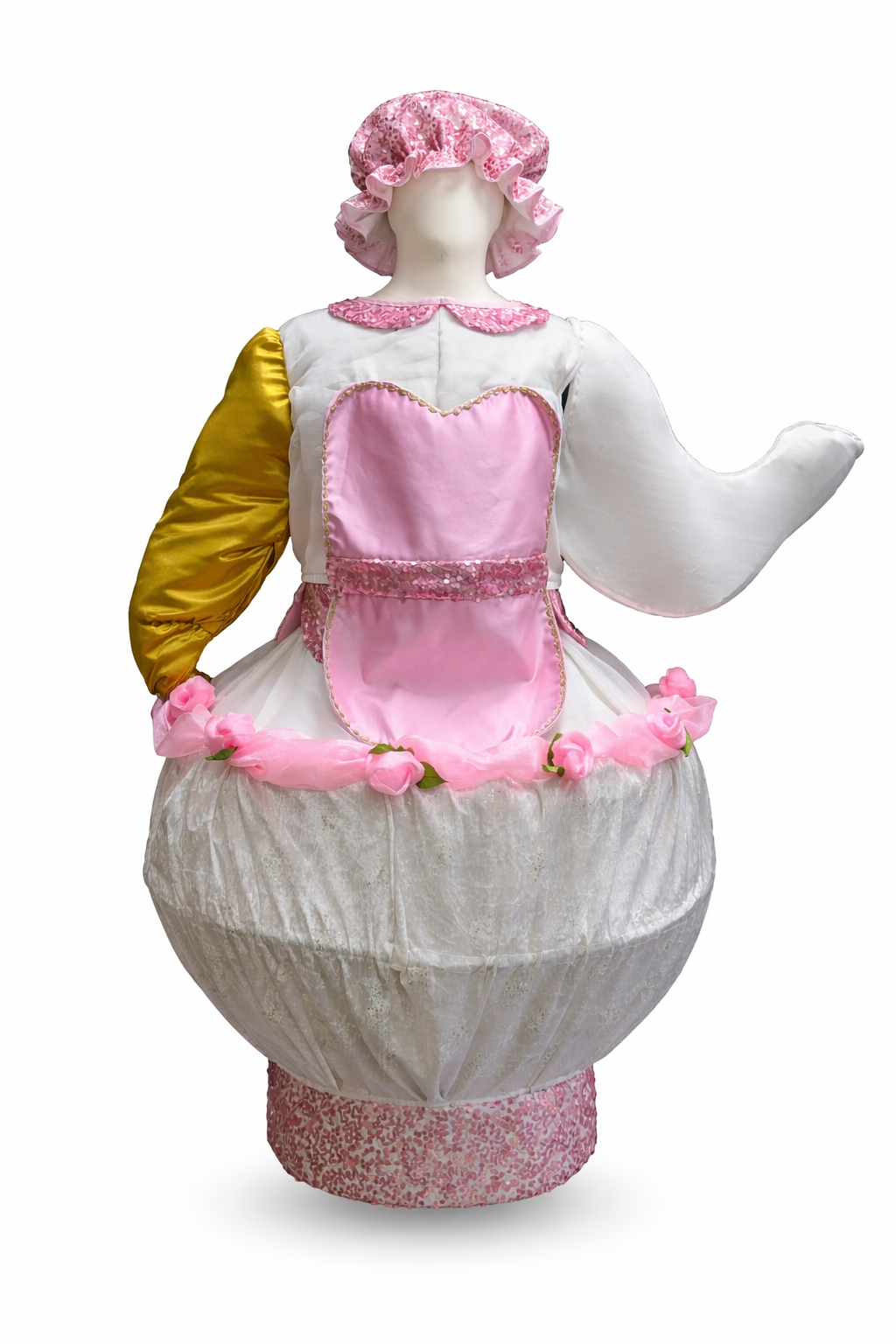 A dress form dressed as a teapot fairy-tale character with a pink and white costume, pink hat, and floral decorations. Mrs Potts, Beauty & the Beast.