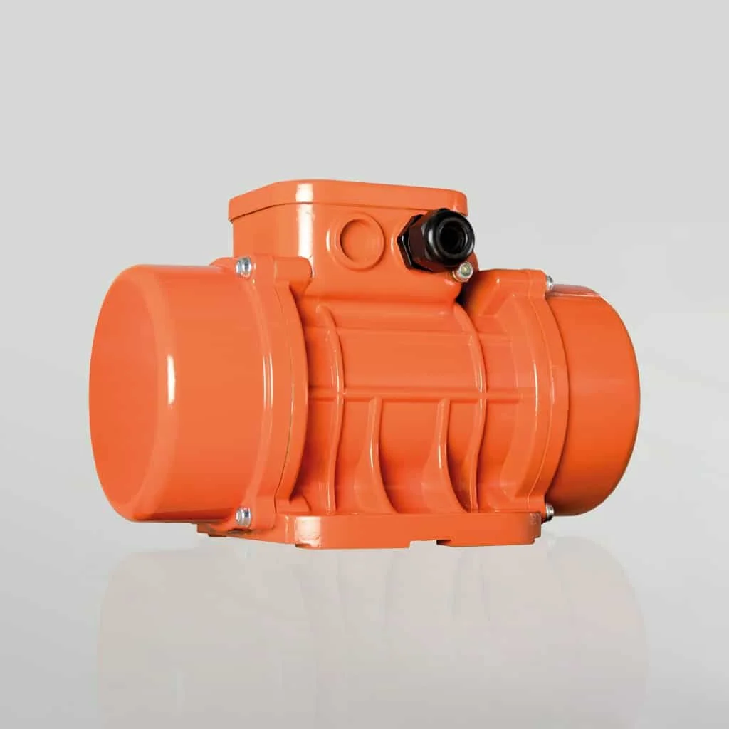 Orange plastic device with cylindrical components and a black nozzle on a white background.