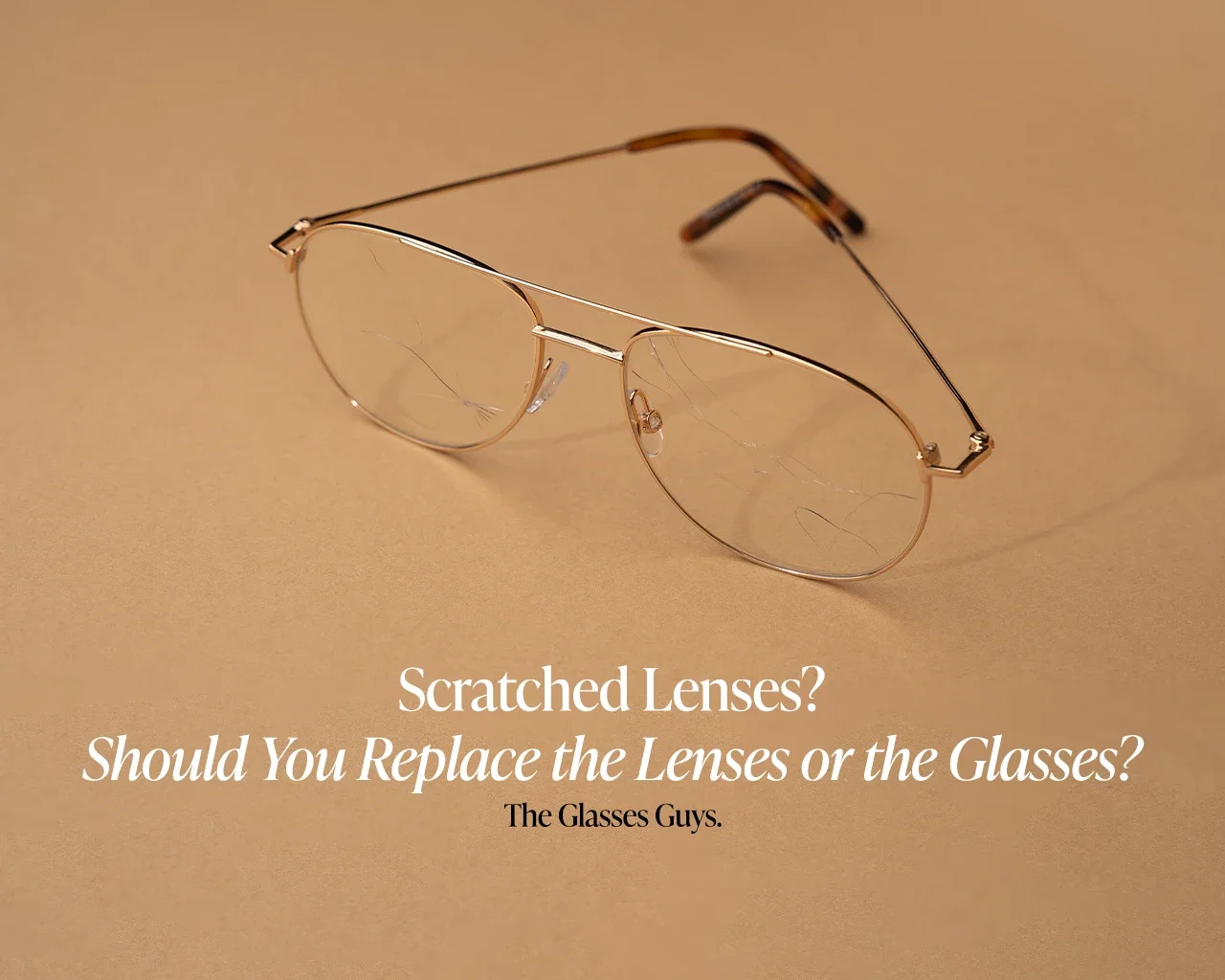 Scratched glasses lenses on metal frames illustrating when to replace lenses or glasses – The Glasses Guys