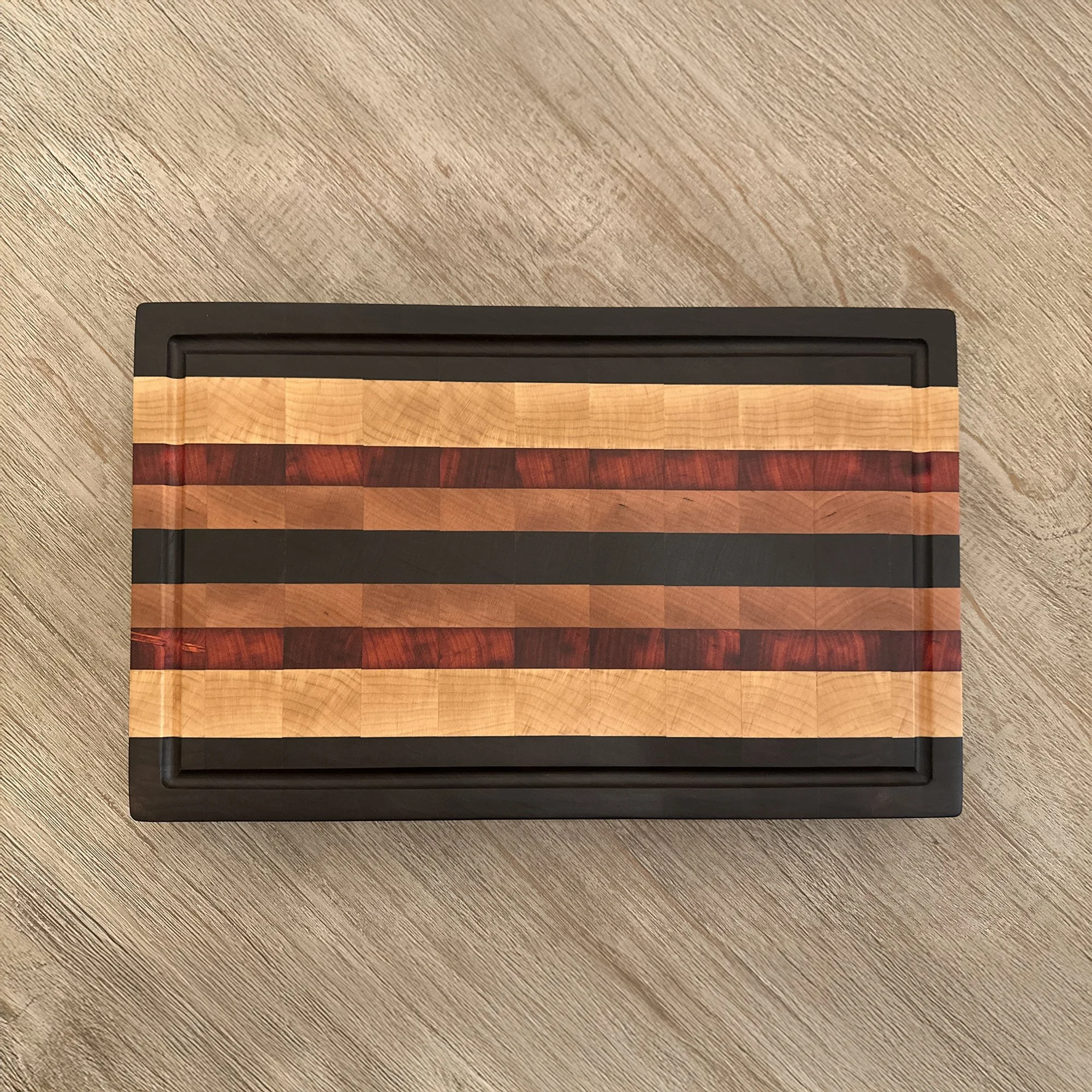 Beautiful End Grain Cutting Board designed from Walnut, Maple, Padauk, and Cherry hardwood.
16 x 10