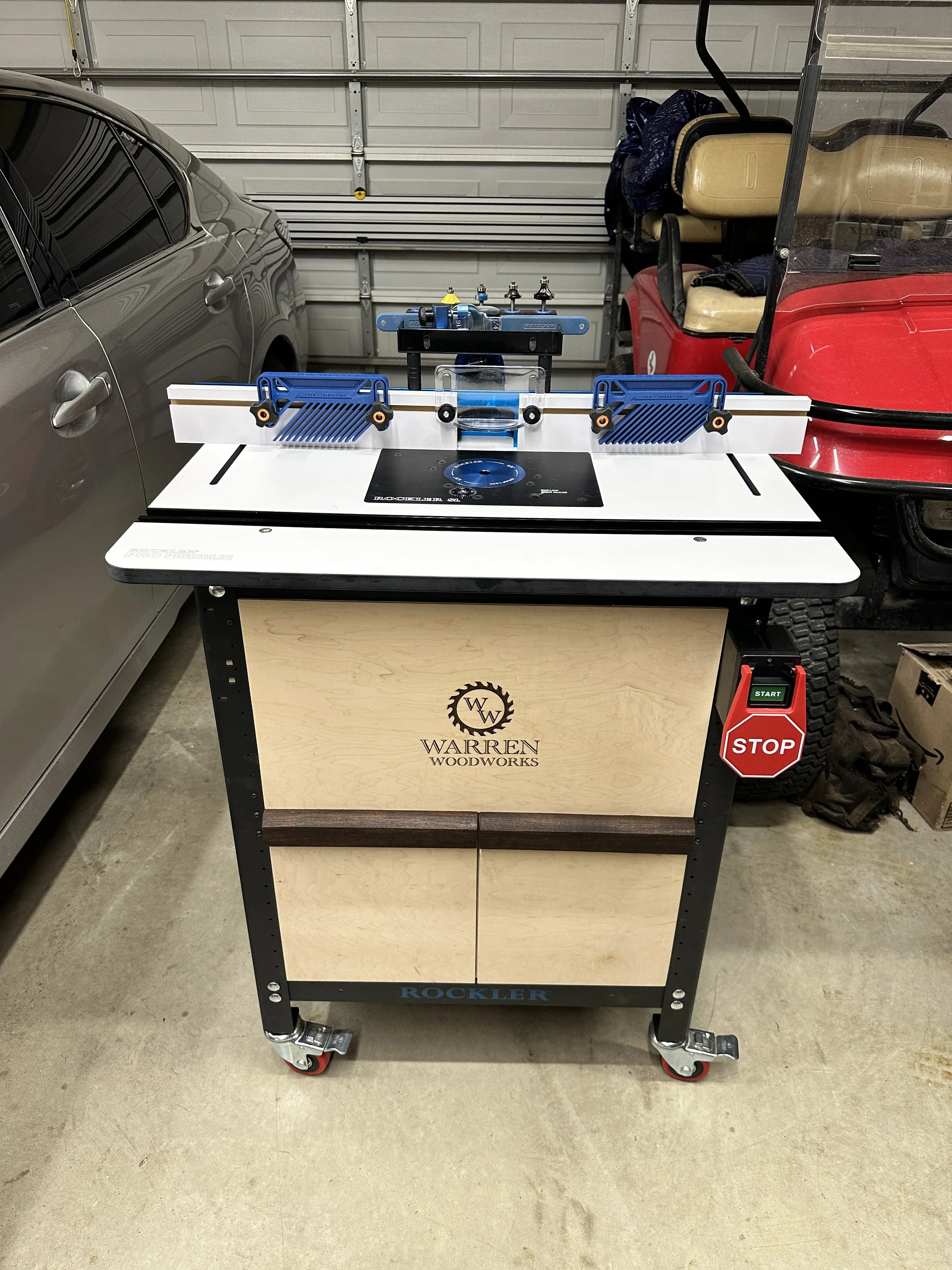 Rockler router table with custom cabinet and drawers.