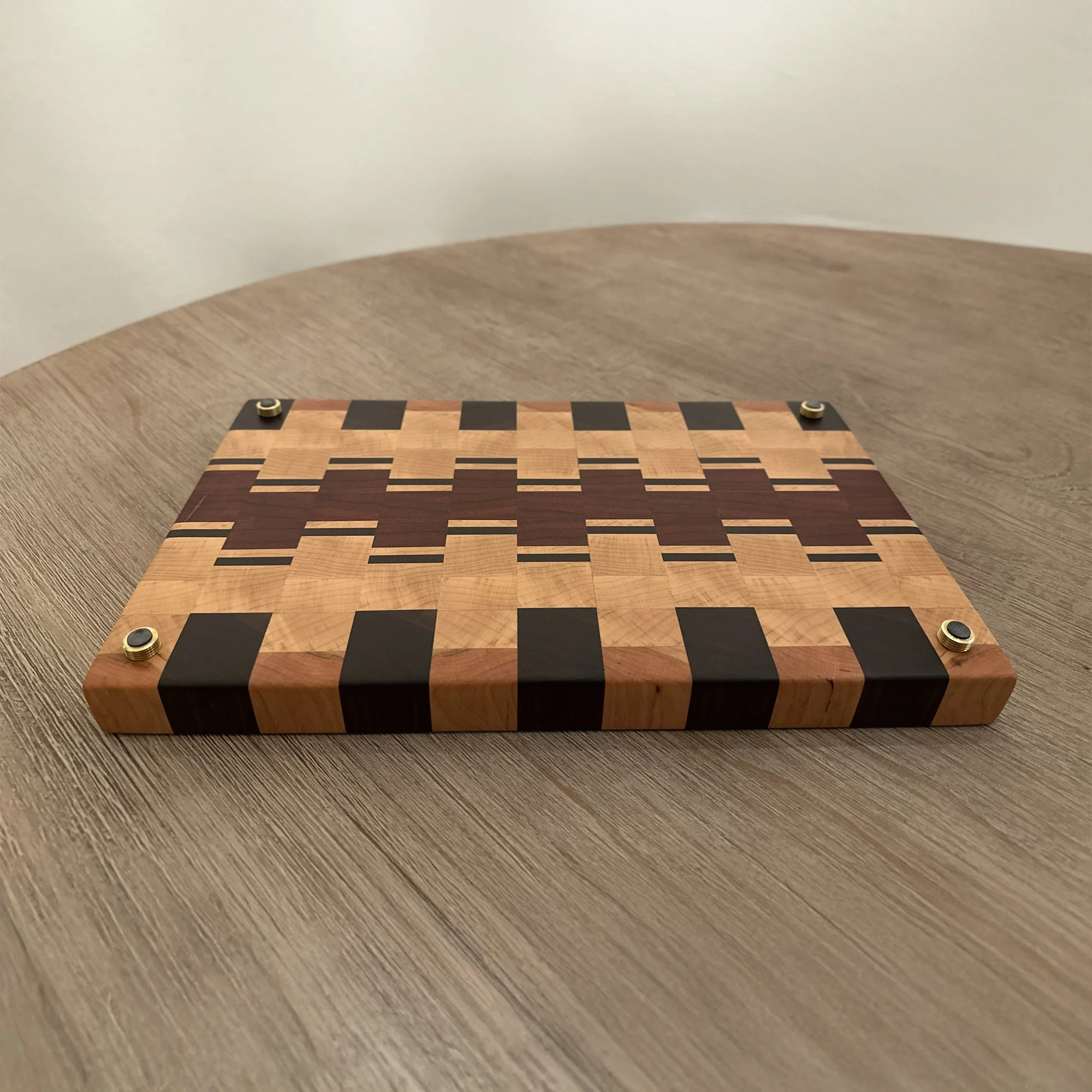 Beautiful End Grain Cutting Board designed from Walnut, Maple, Padauk, and Cherry hardwood, arranged in an eclectic pattern.
16 x 10