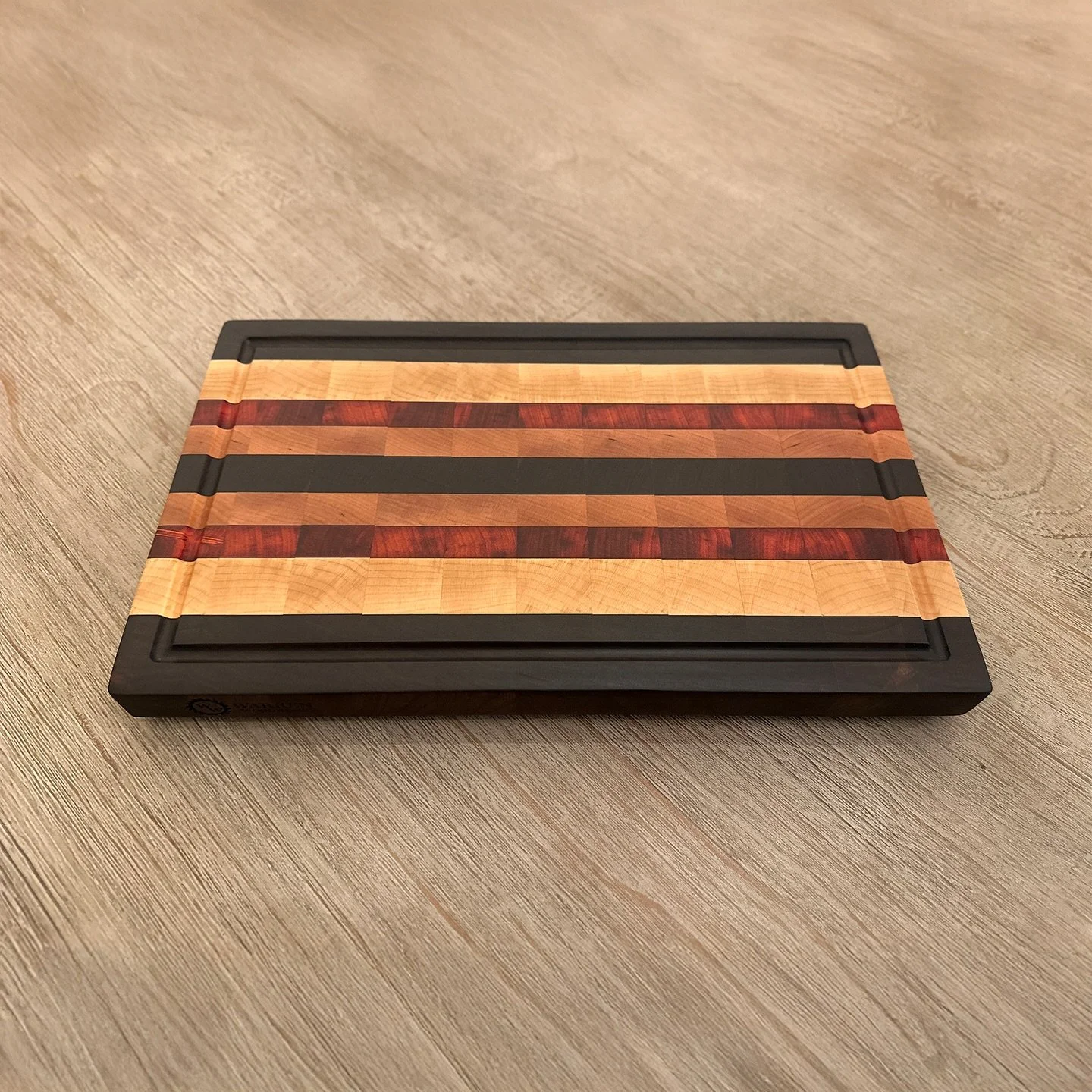 Crafted for beauty, built for daily use.
This 1.3” thick end grain cutting board is a true workhorse in the kitchen—handmade from premium Walnut, Cherry, Maple, and Padauk. The rich contrast of these hardwoods creates a stunning pattern