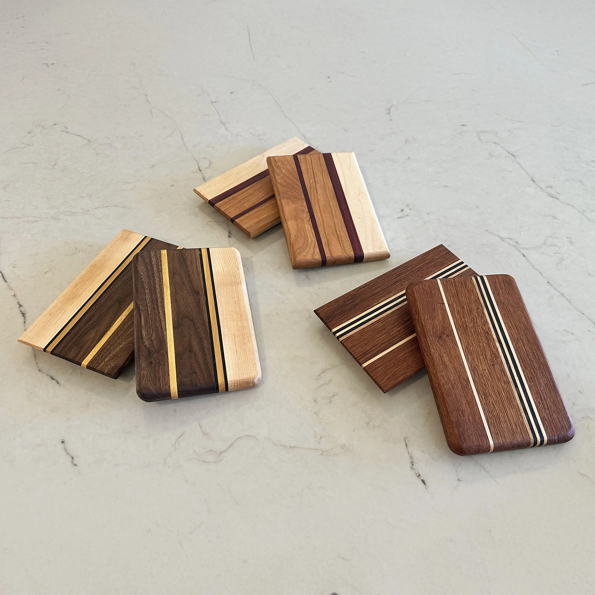 Six Hardwood Cheese boards with various striped designs. 7-1/2 x 5-1/4 x 3/4